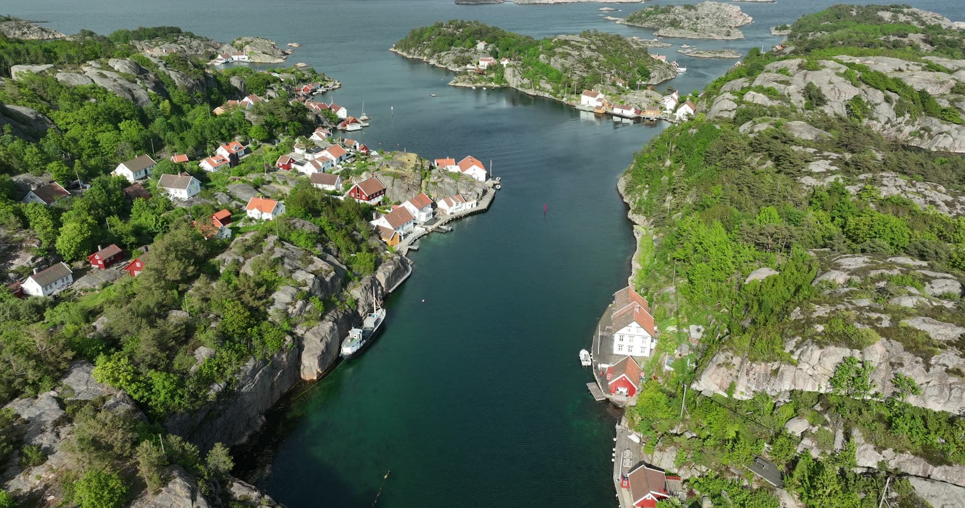 Red roof houses and deep blue water, Ny-Hellesund