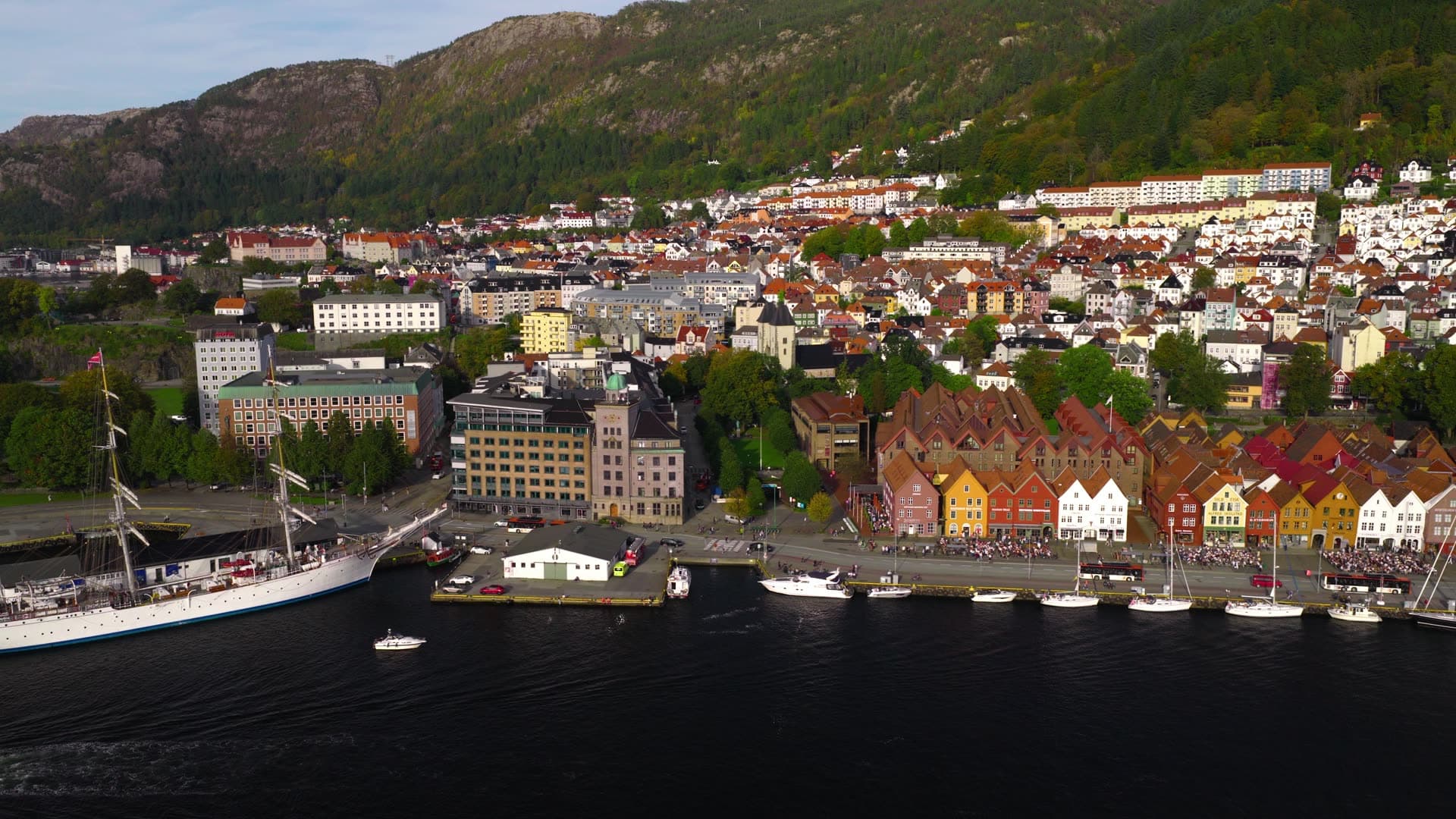 Tall ship moored beside historic gabled district, Bryggen, Bergen, Norway
