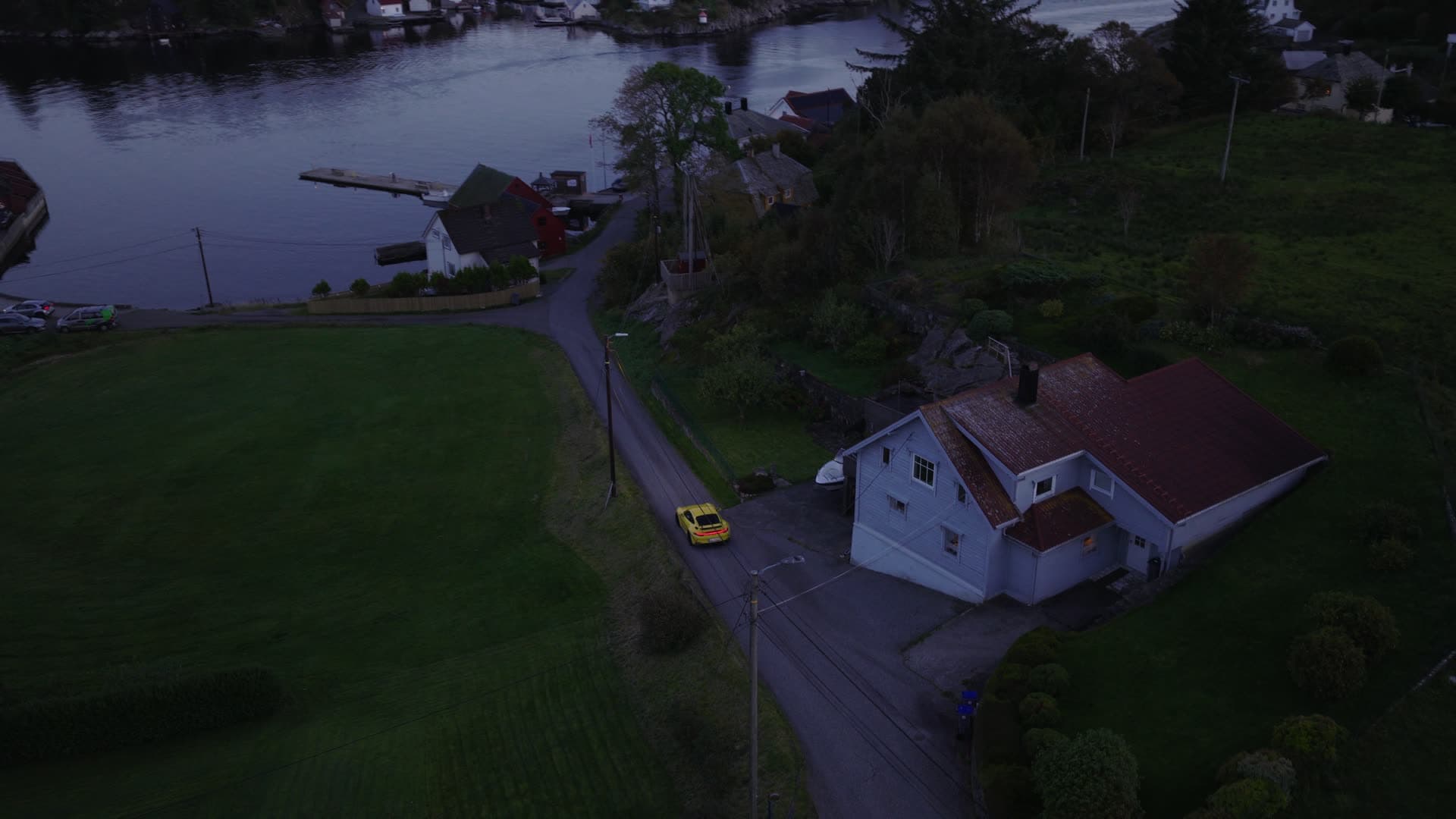 Yellow car coastal road evening, Herdla