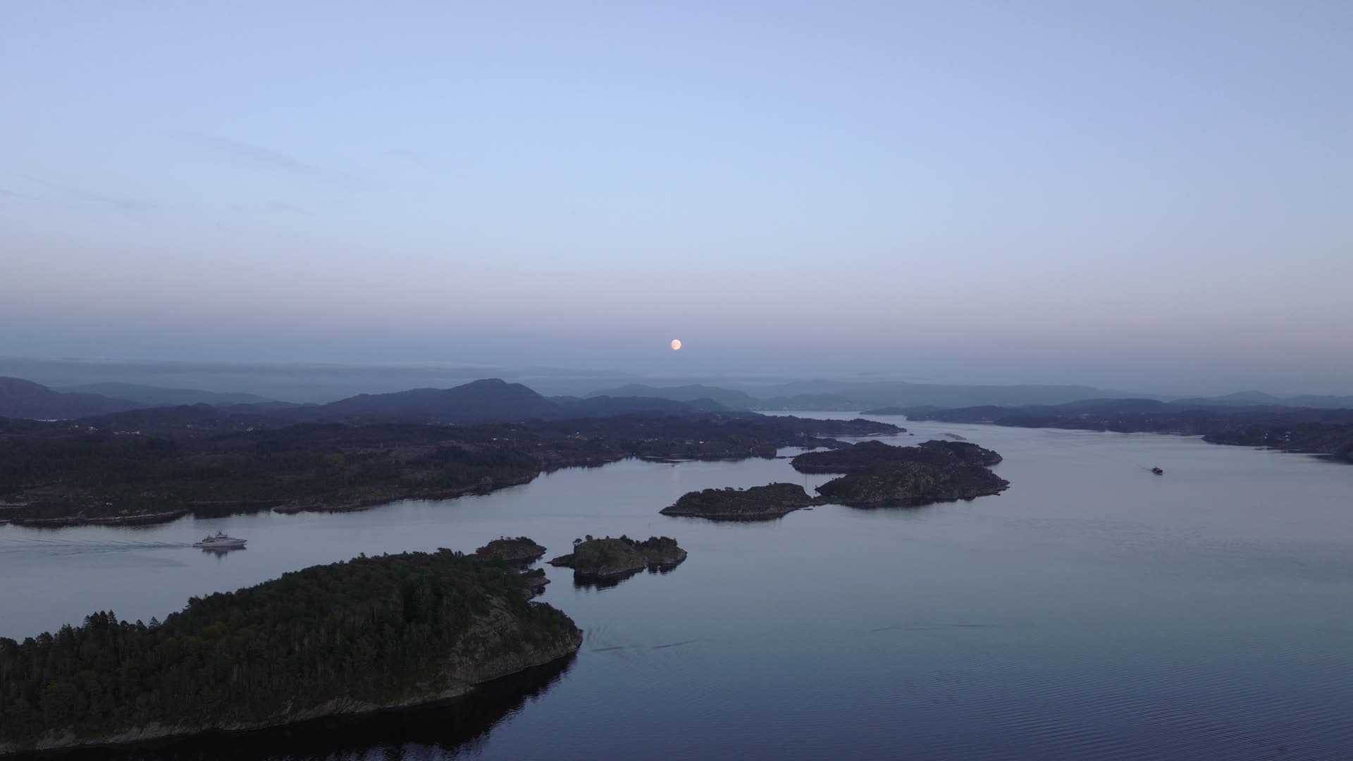 Forest-covered archipelago with rising moon, Herdla