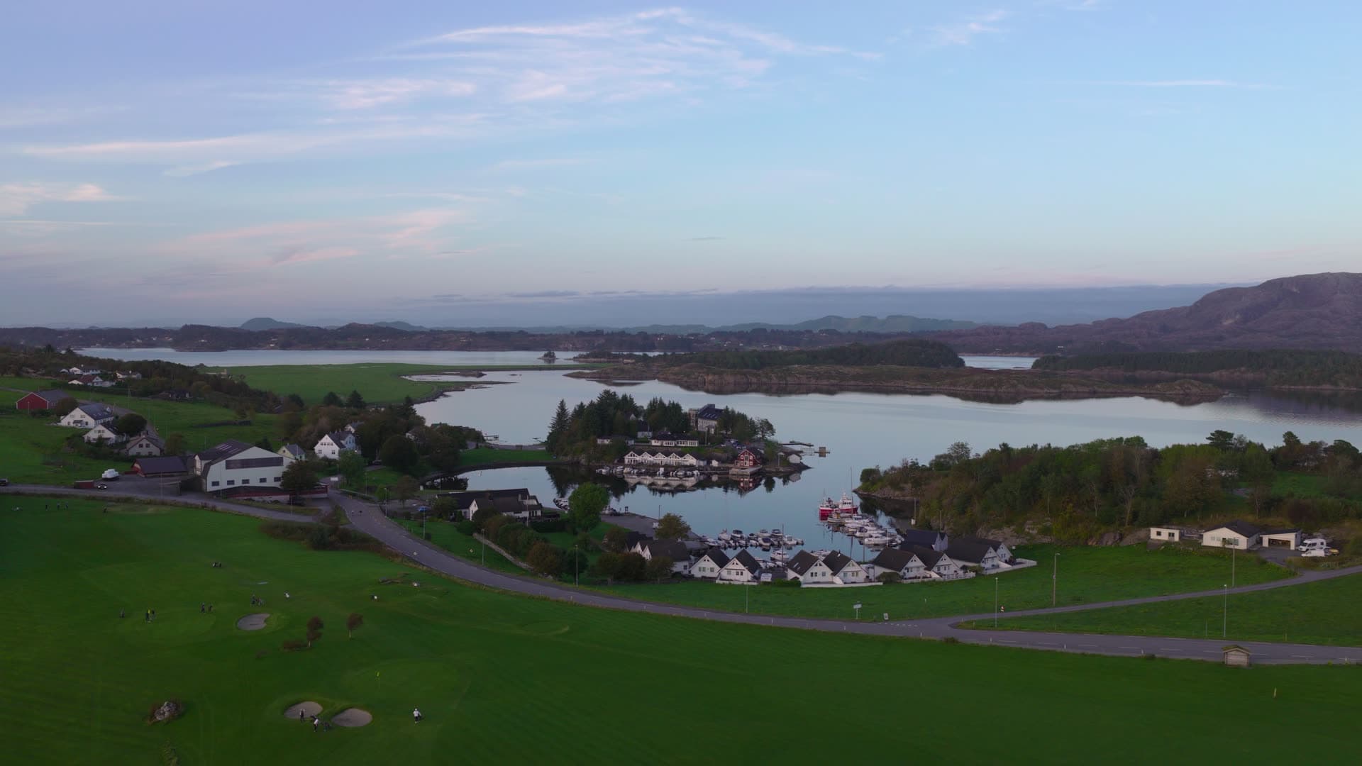 Lakeside village with islands and waterfront, Herdla