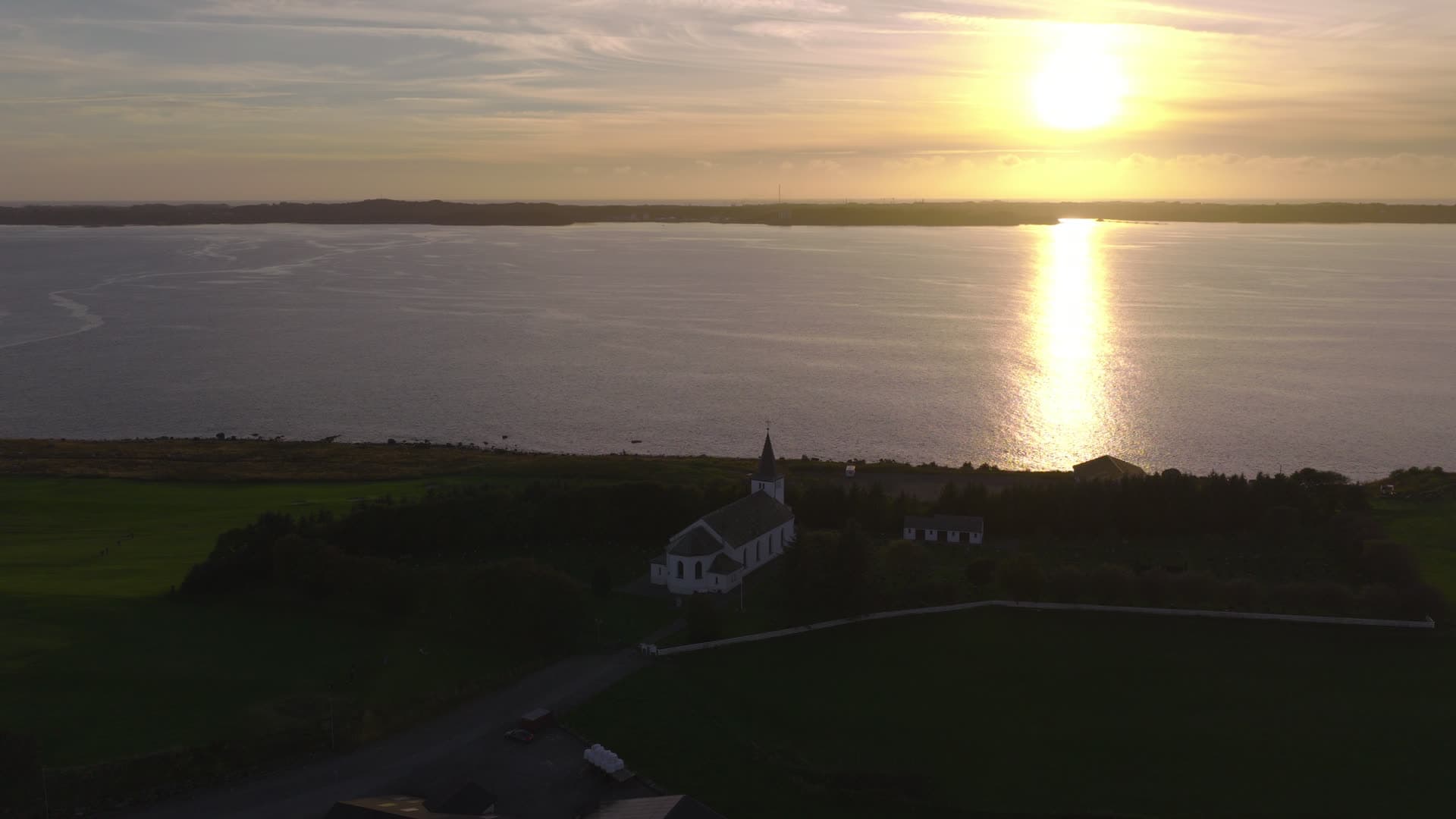 White church at coastal sunset, Herdla