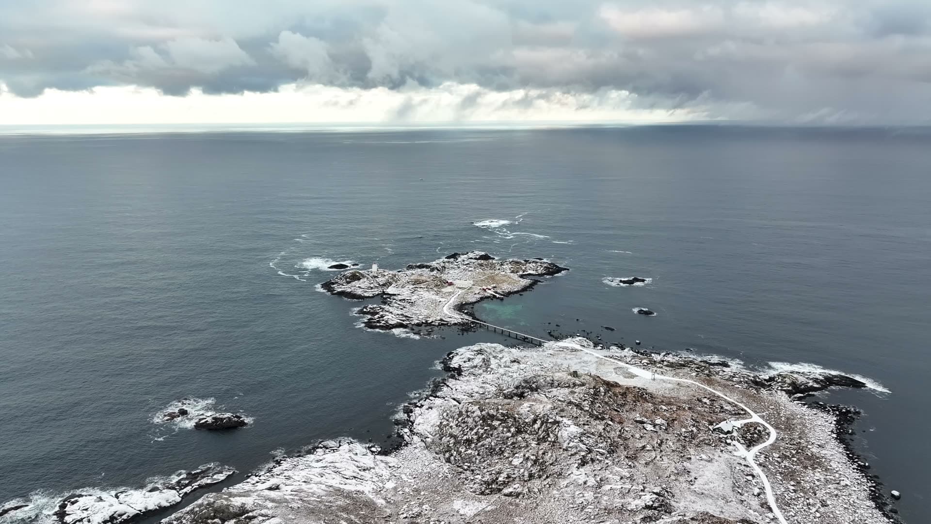 Wide winter aerial view of Ulla lighthouse and surrounding coast