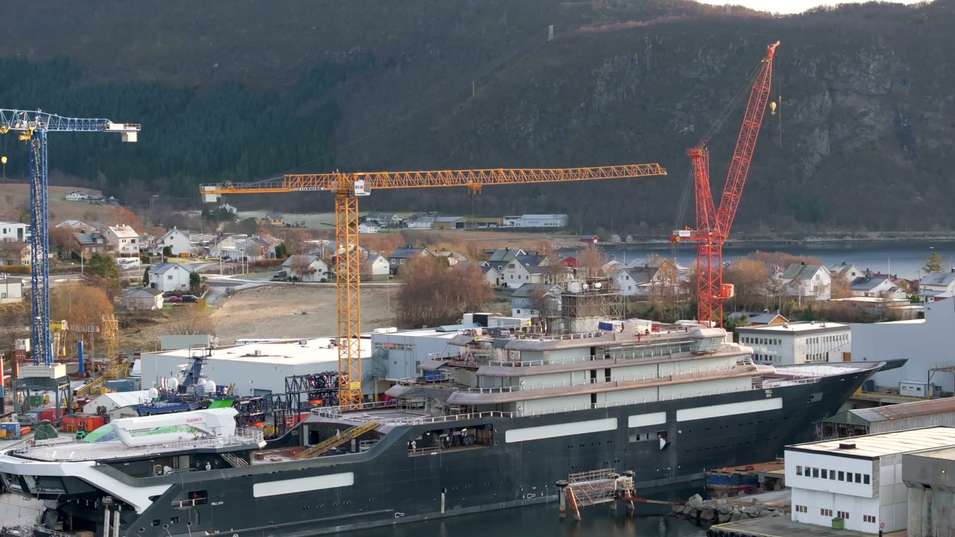 Aerial view along REV Ocean with cranes and Søvik in the background