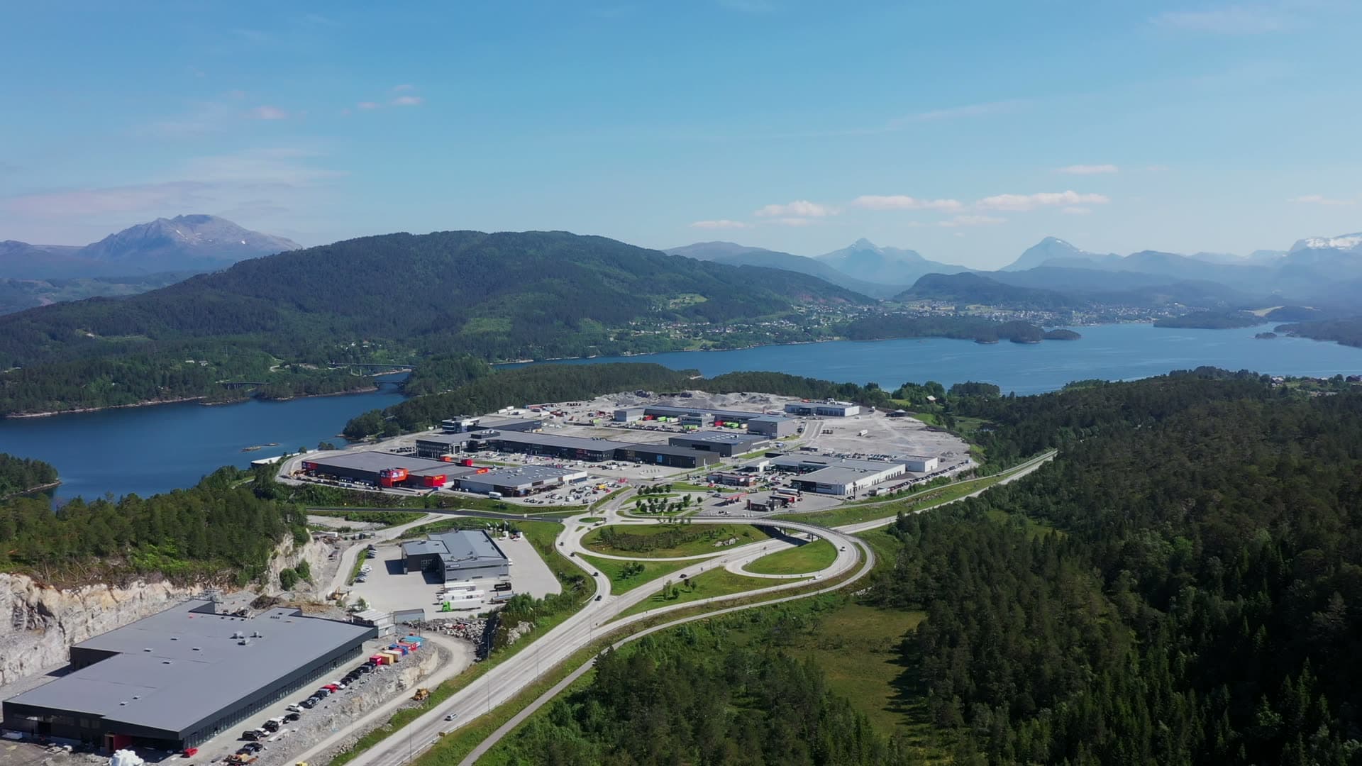 Wide aerial view of Digernes business park and wooded hills