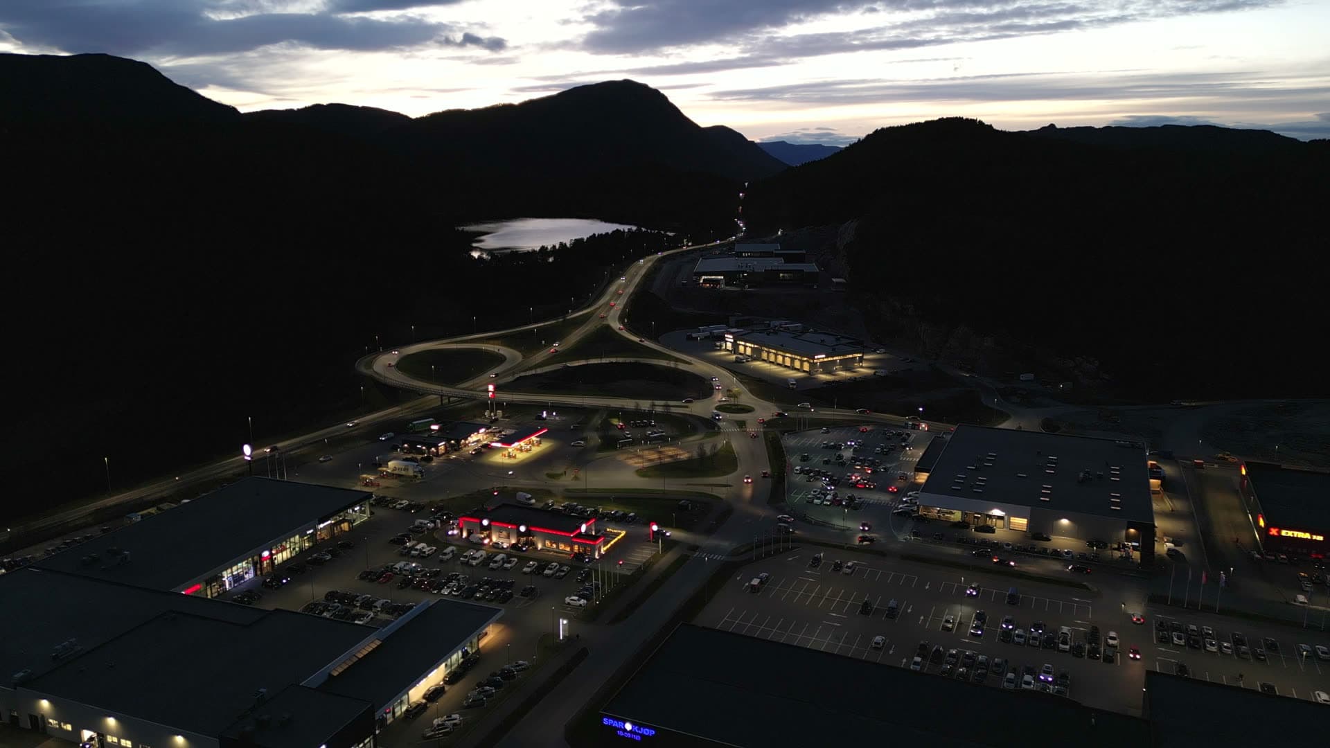 Wide drone view of Digernes shopping park at dusk
