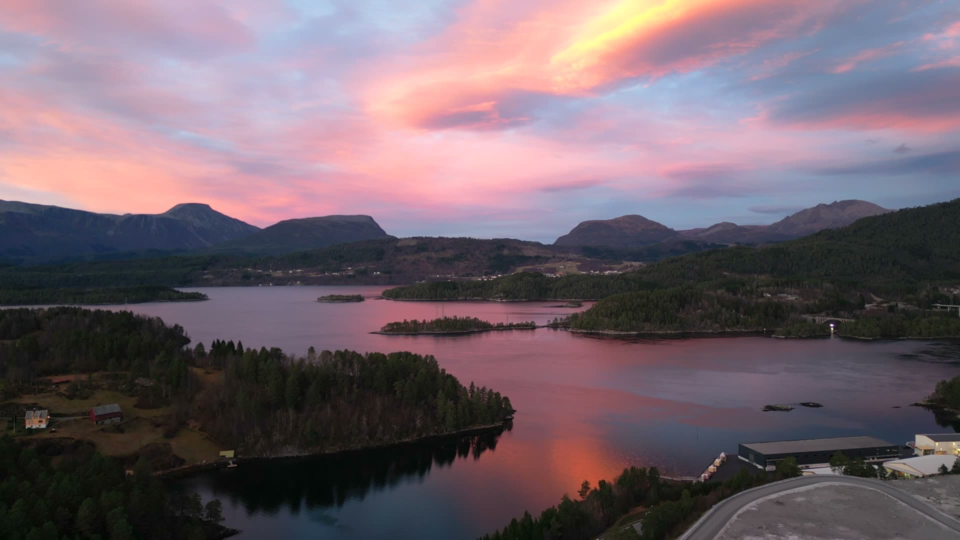 Pink sunset reflected in the water at Digernes