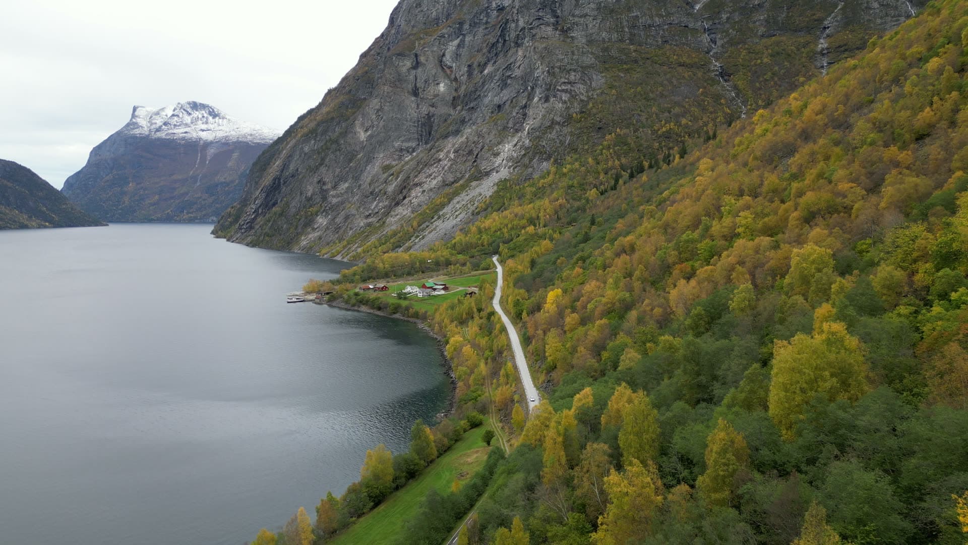 Lakeside road and rural settlement at Vike in autumn