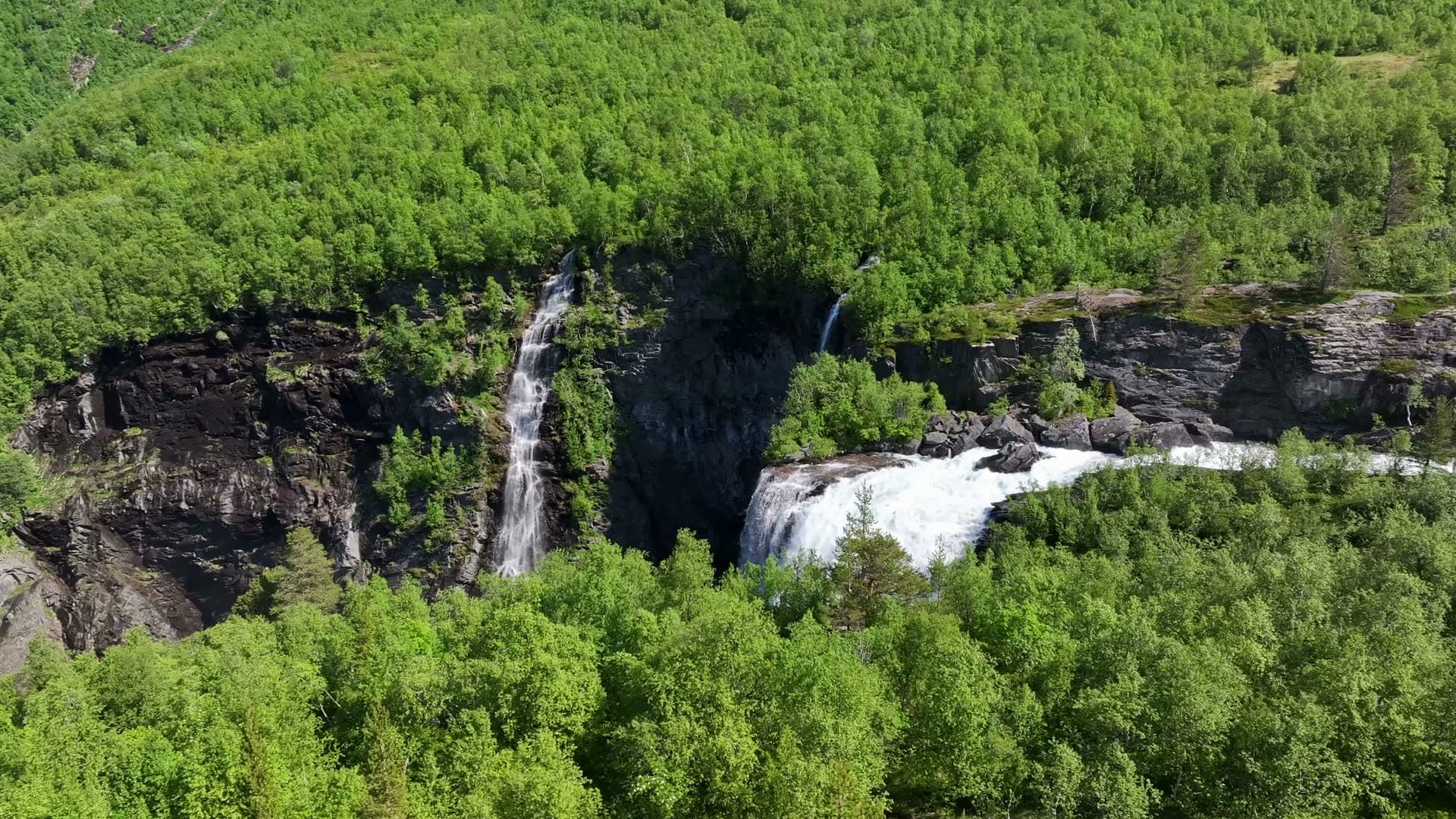 Aerial descent over Reindalsfossen waterfall in Tafjord