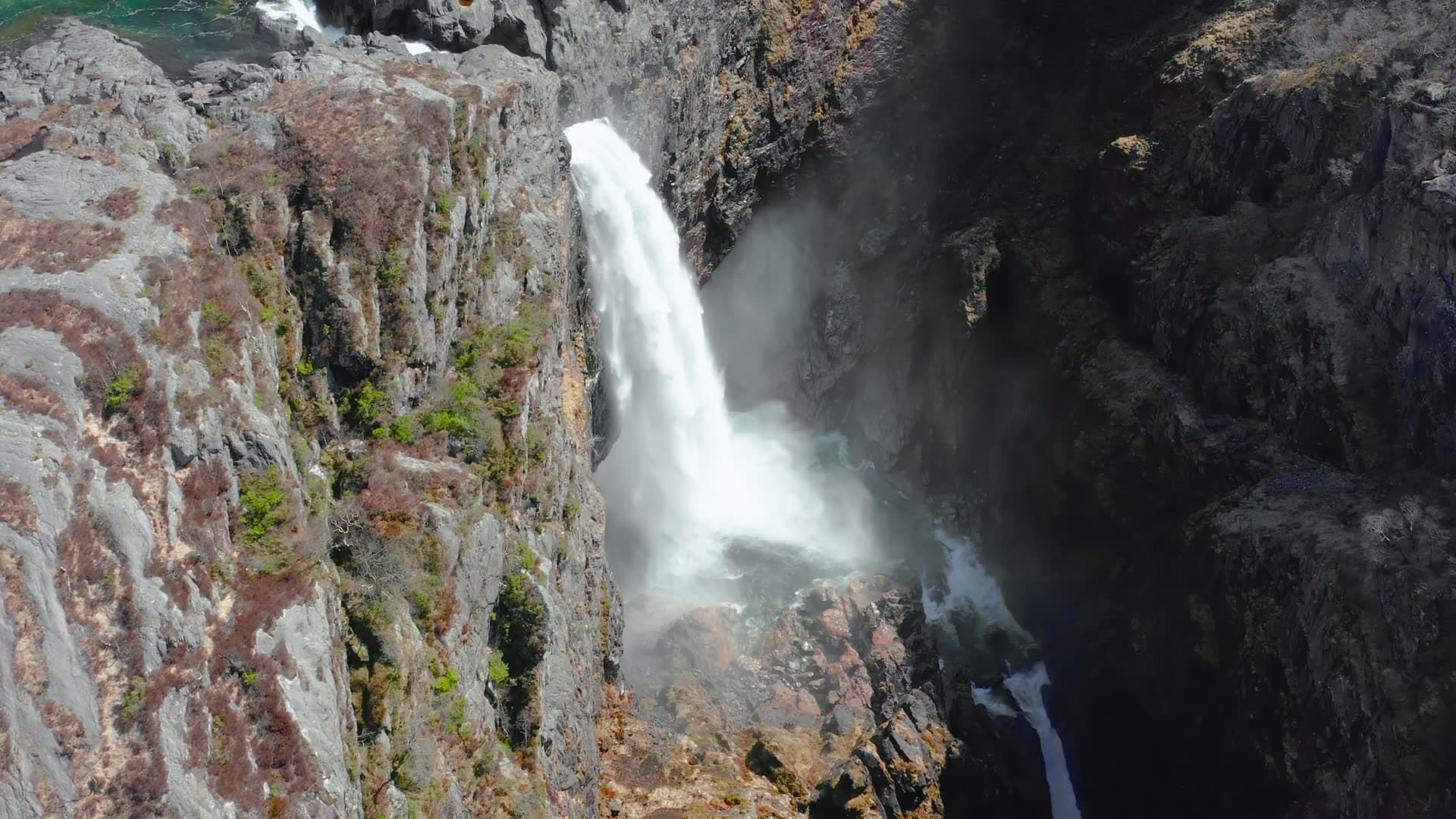 Waterfall plunging through narrow canyon, Månafossen