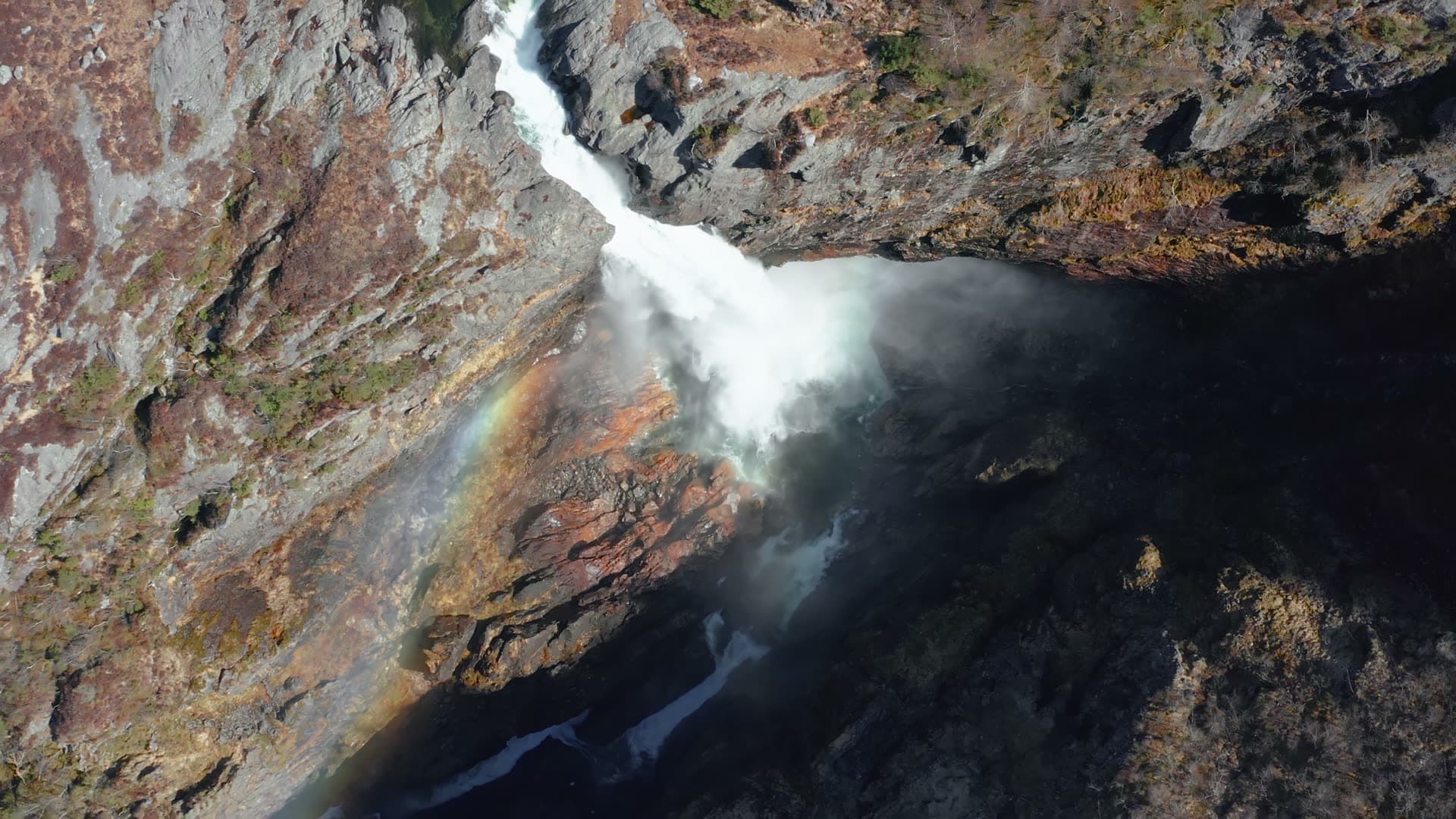 Waterfall cascading through rocky canyon, Månafossen