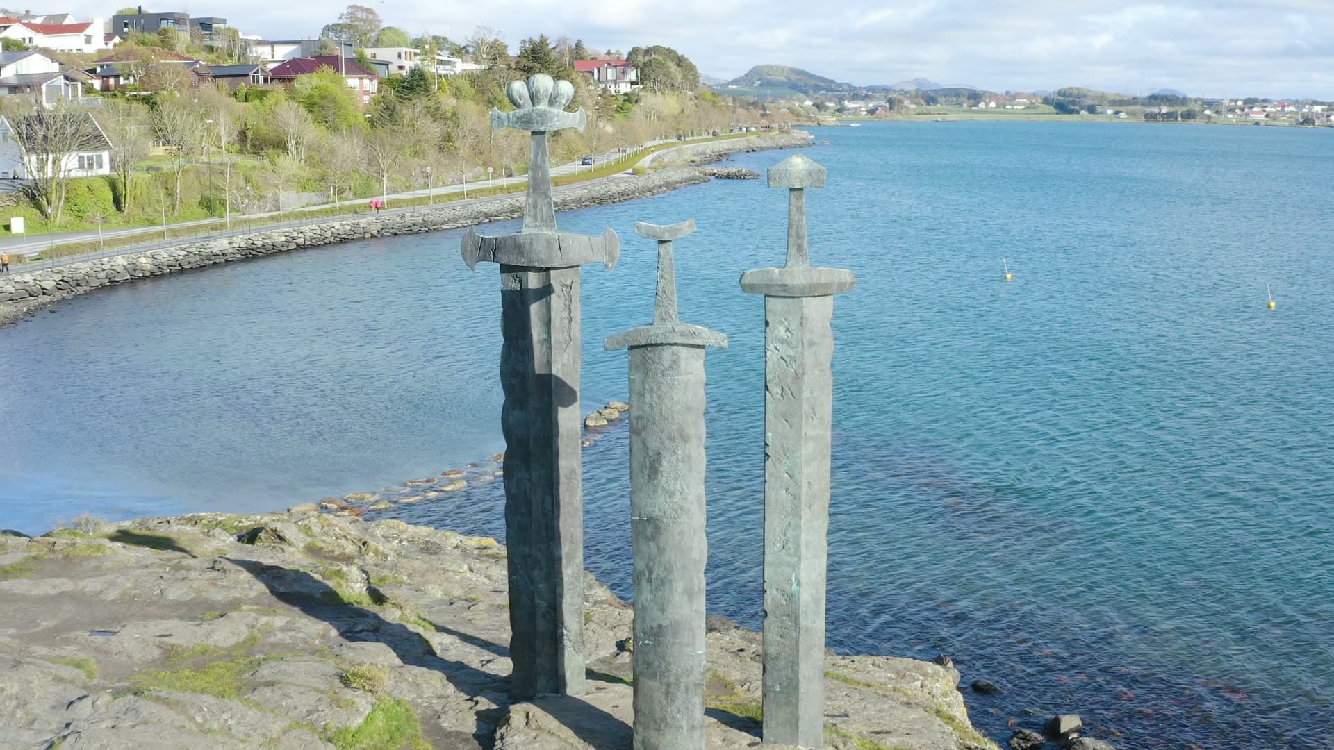 Three Swords in stonel crosses overlooking coastal bay, Sverd i fjell