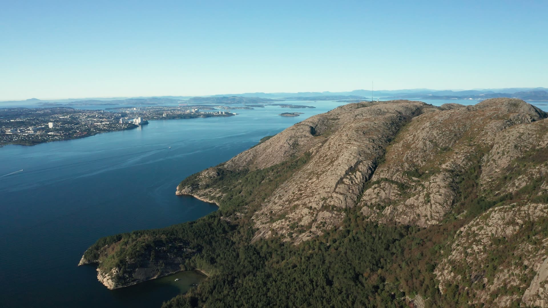 Rocky mountain overlooking forested fjord landscape, Dalsnuten
