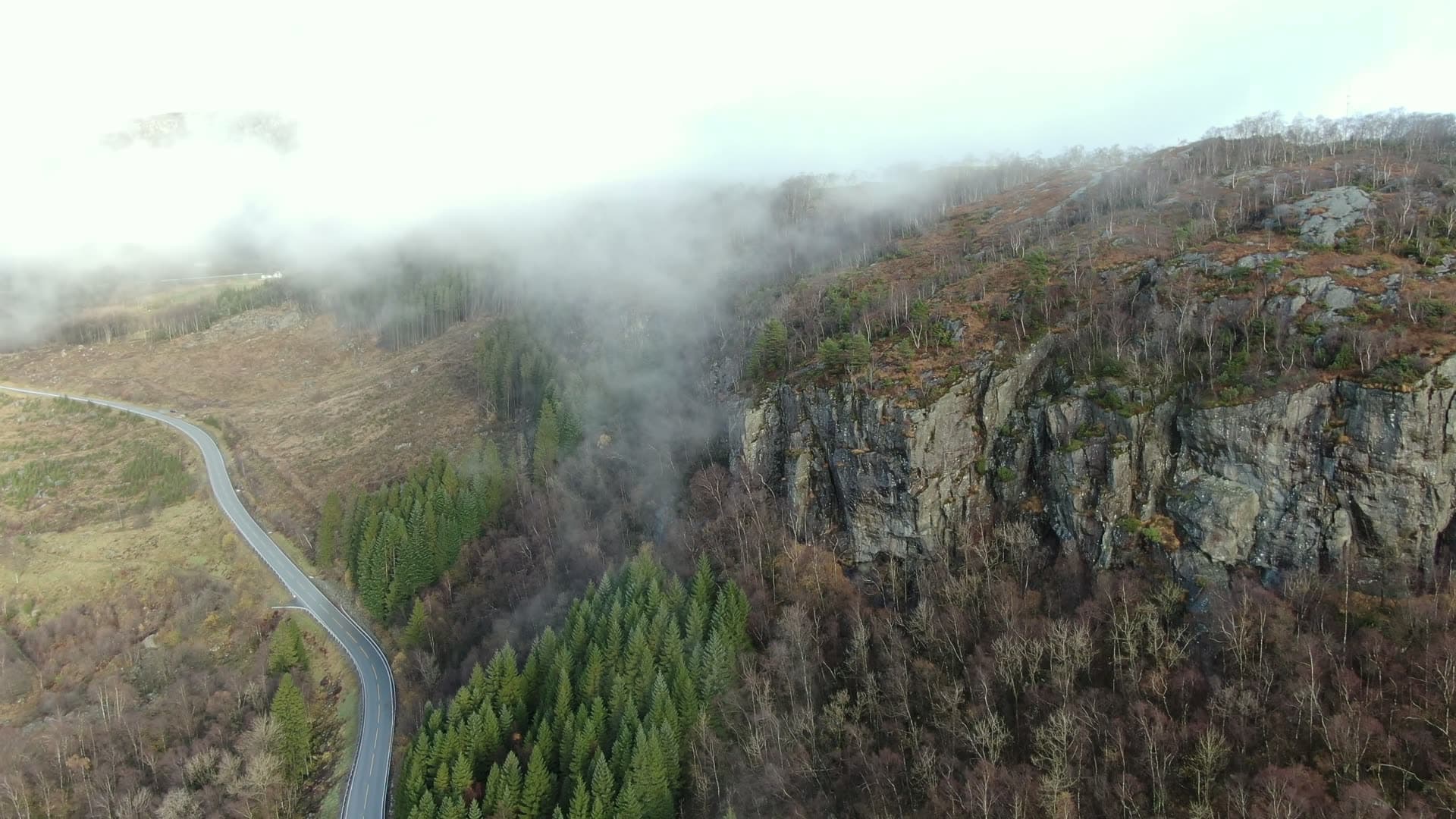 River valley with cliff face and mist, Ingvaldstad