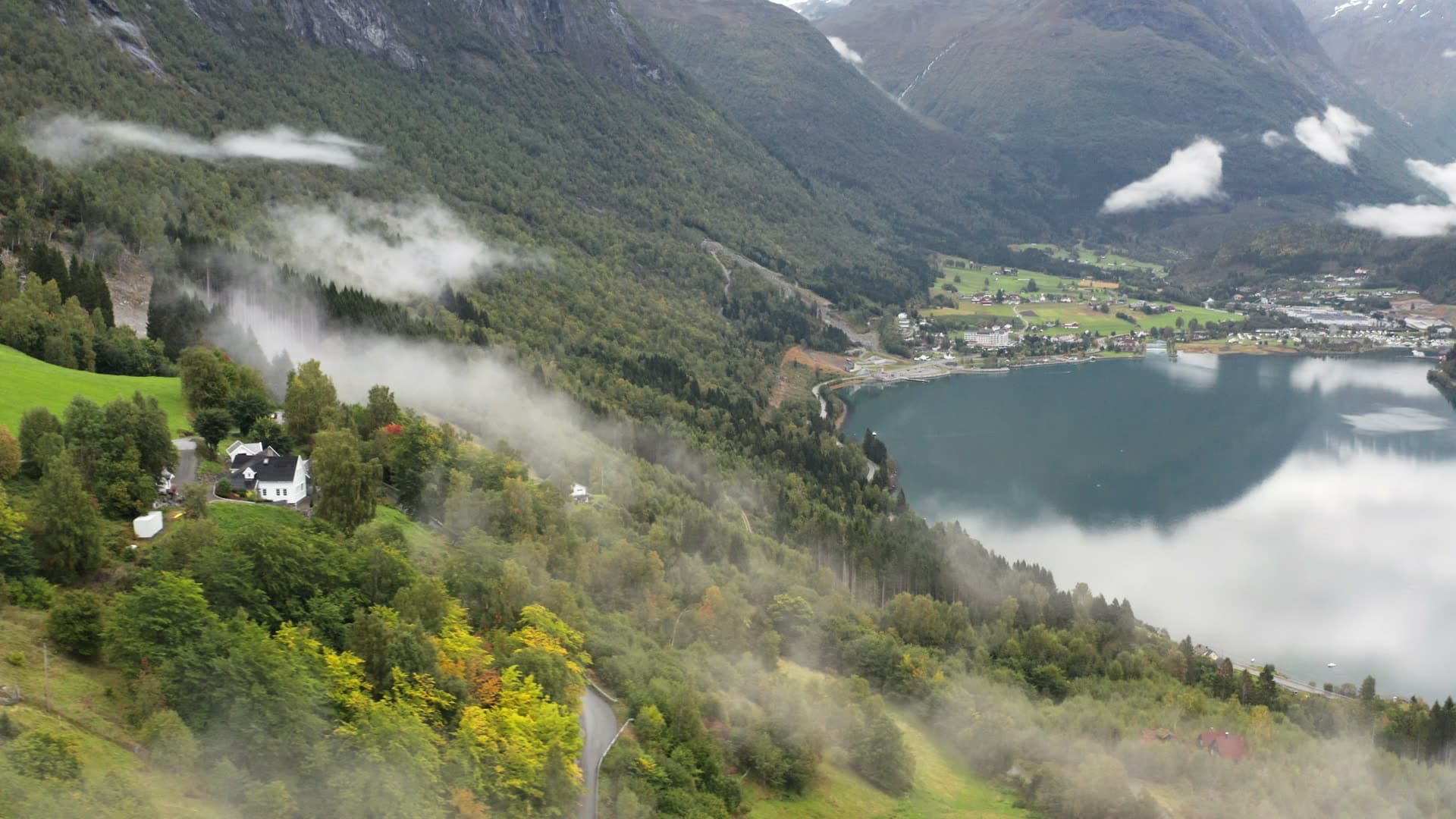 Mountain lake with misty forested valley, Innvikfjorden