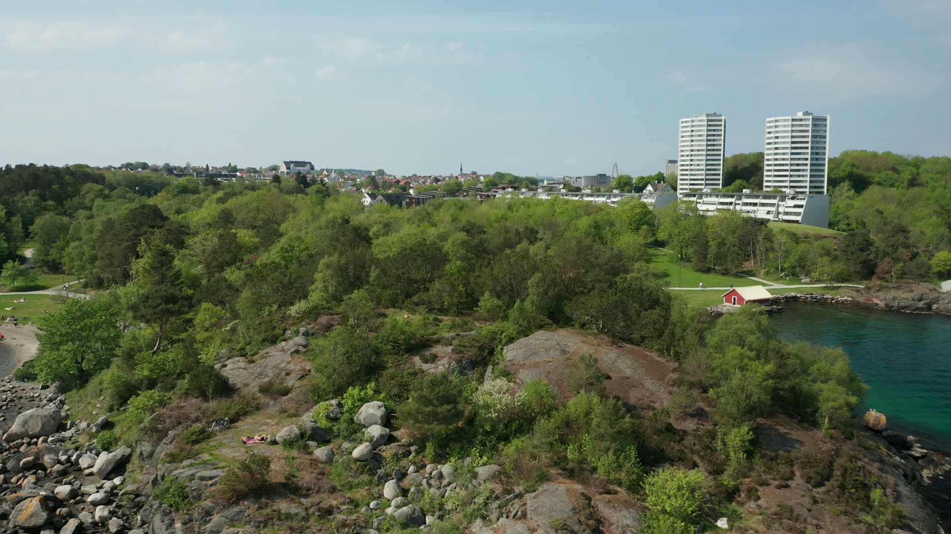 Forested peninsula with apartment towers and waterfront, Stavanger