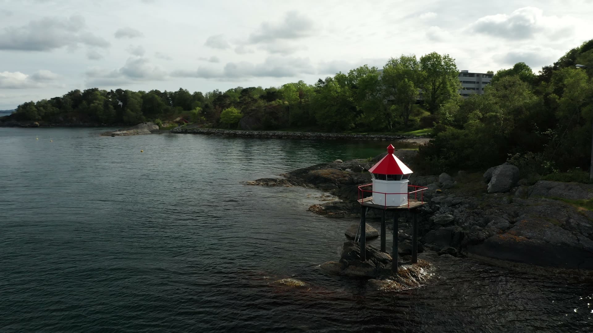 Red and white coastal lighthouse beacon, Lervig