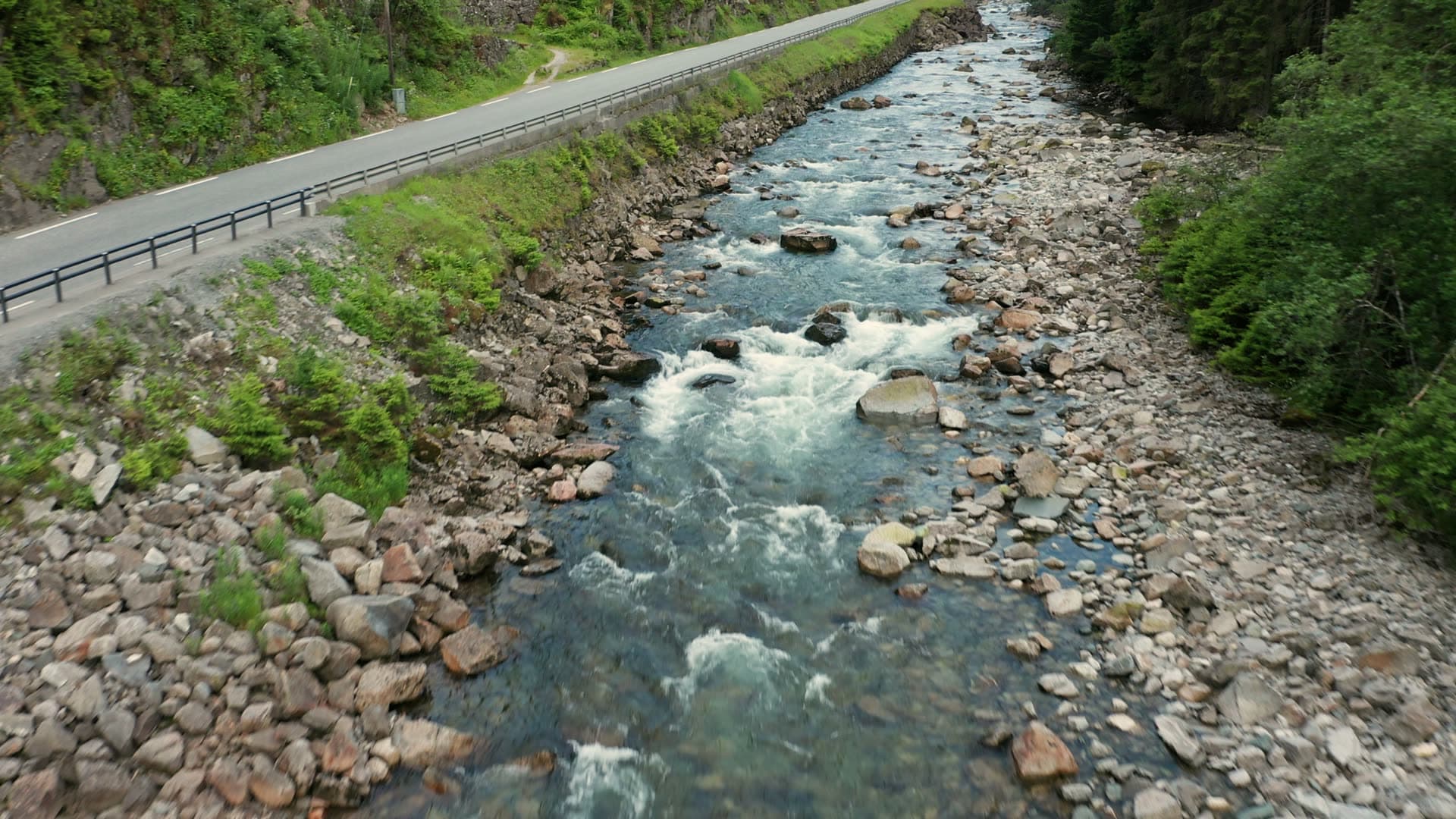 Alpine river with stone bridge and road, Låtefossen