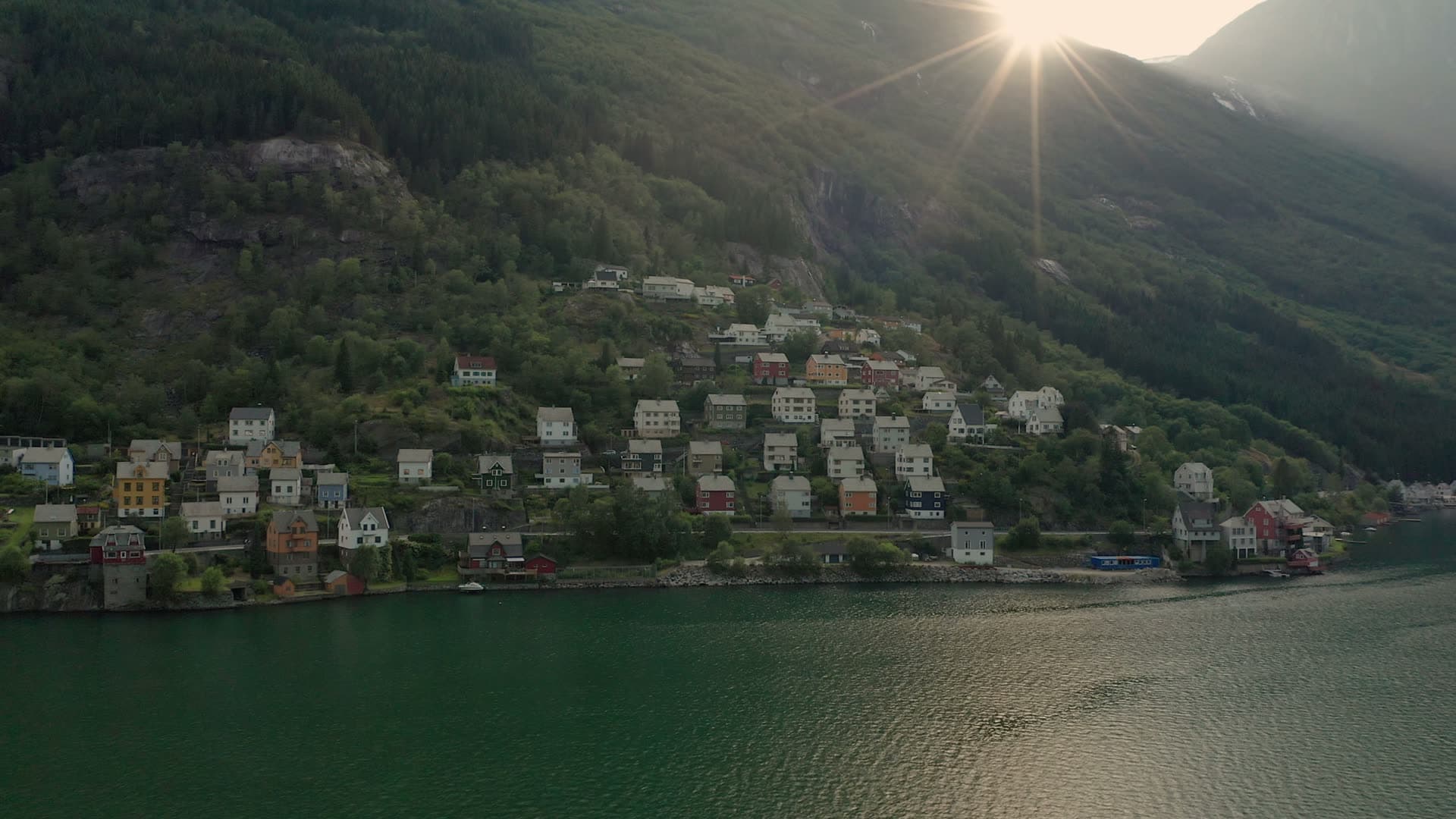 Mountain village on fjord at sunrise, Odda