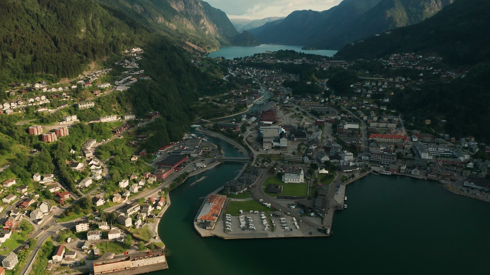 Town in mountain valley with fjord, Odda