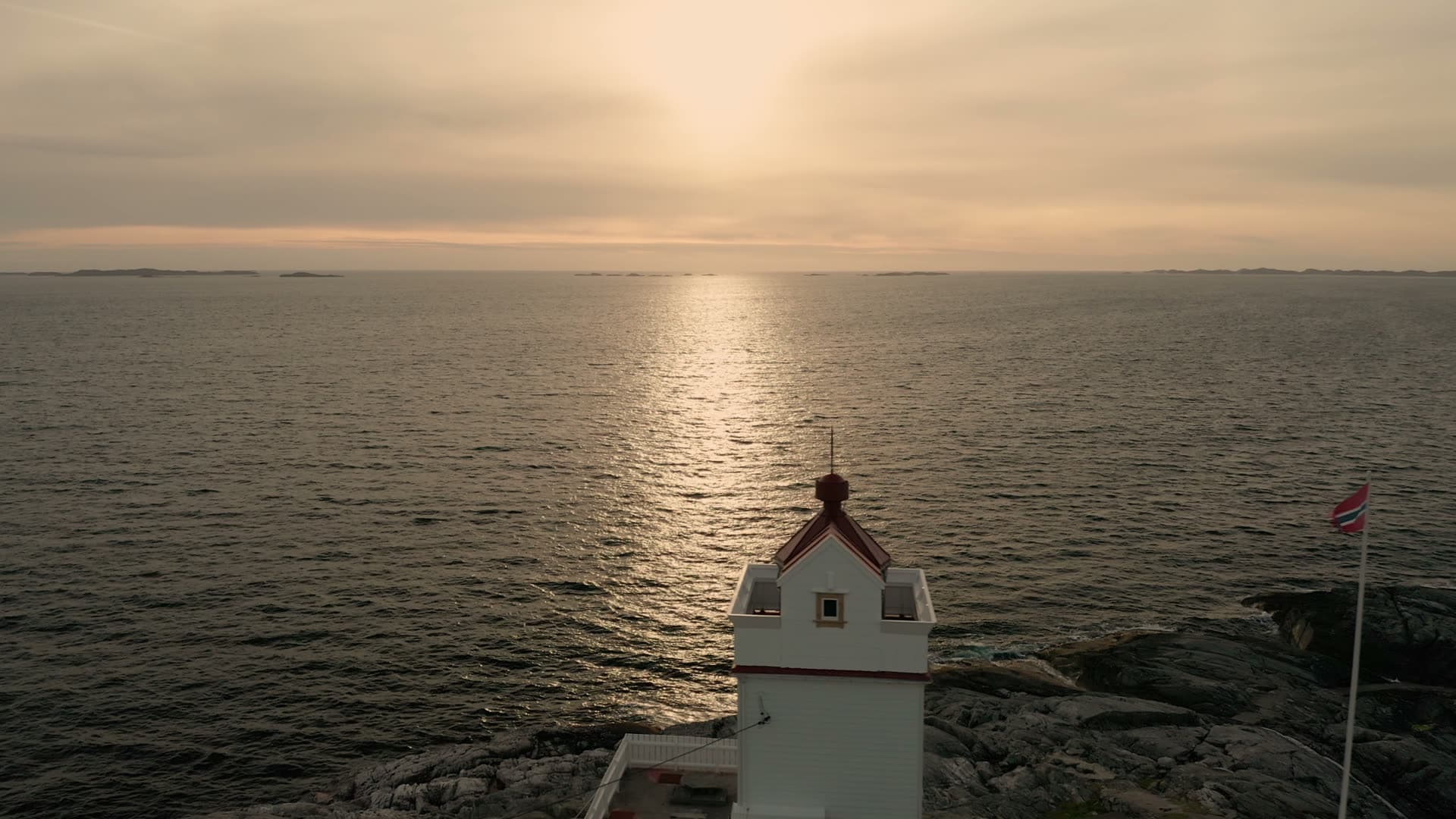 Lighthouse on rocky coastal promontory, Ryvarden fyr