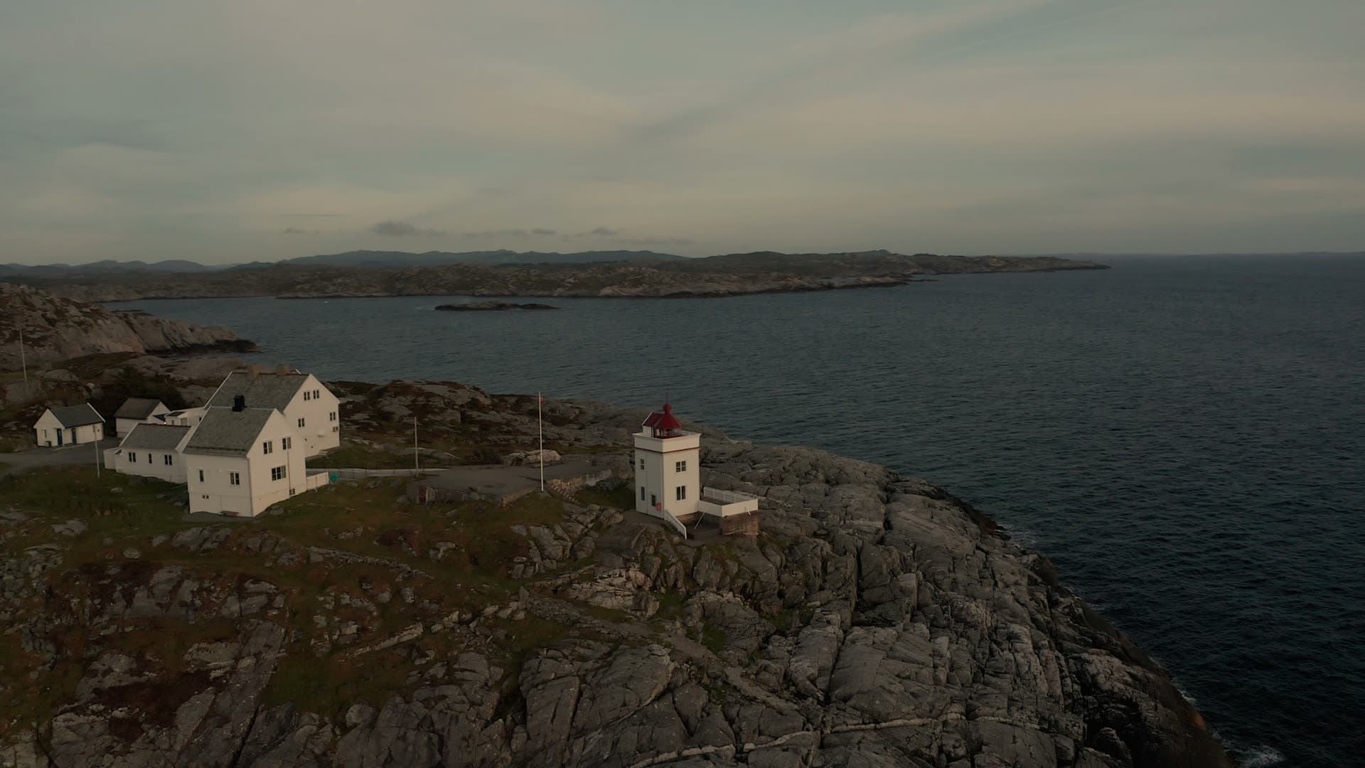 Lighthouse on rocky coastal headland, Ryvarden fyr