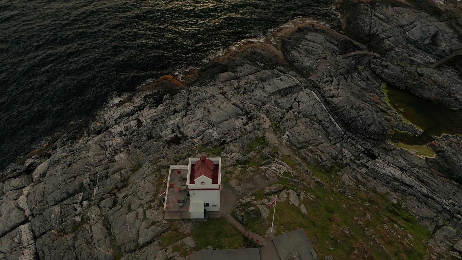 Coastal lighthouse on rocky cliff, Ryvarden fyr