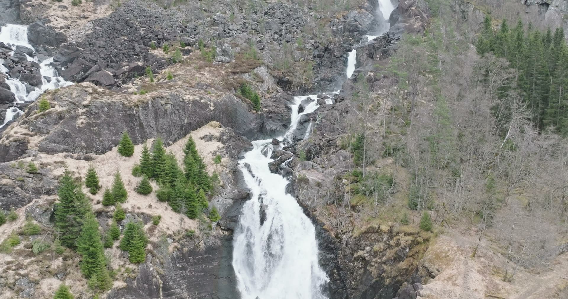 Mountain river with cascading whitewater rapids, Låtefossen