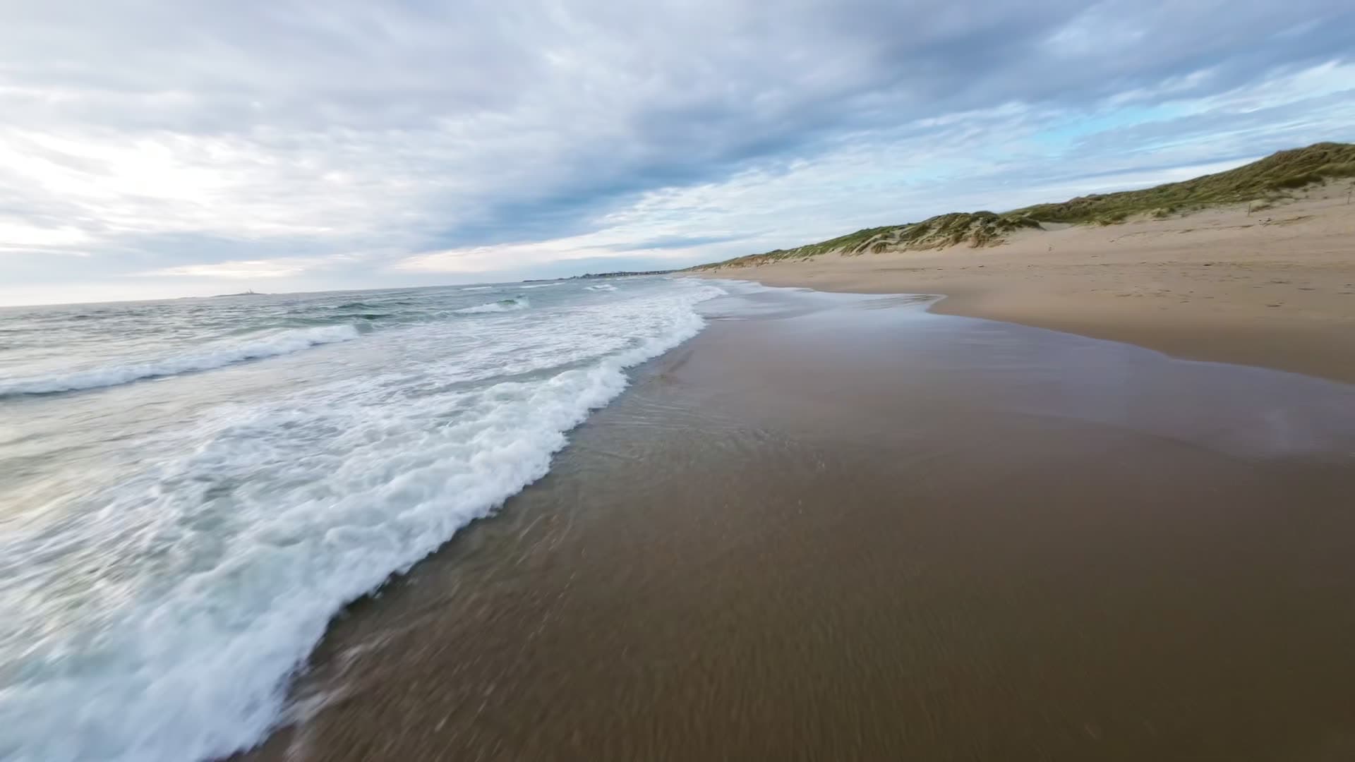 Waves rolling onto sandy beach, Boresanden