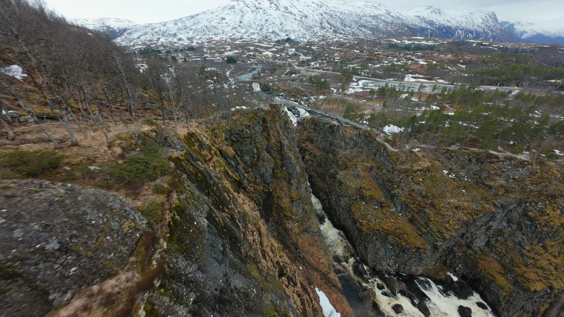 River gorge with flowing white water and rocky cliffs, Vøringsfossen