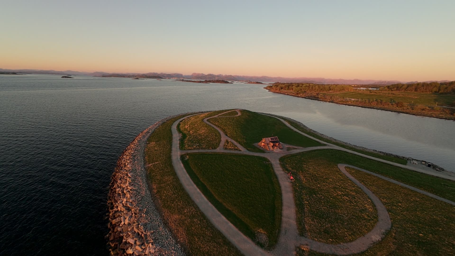Coastal polder with protective dyke at sunset, Stavanger, Hundvåg dagturshytta