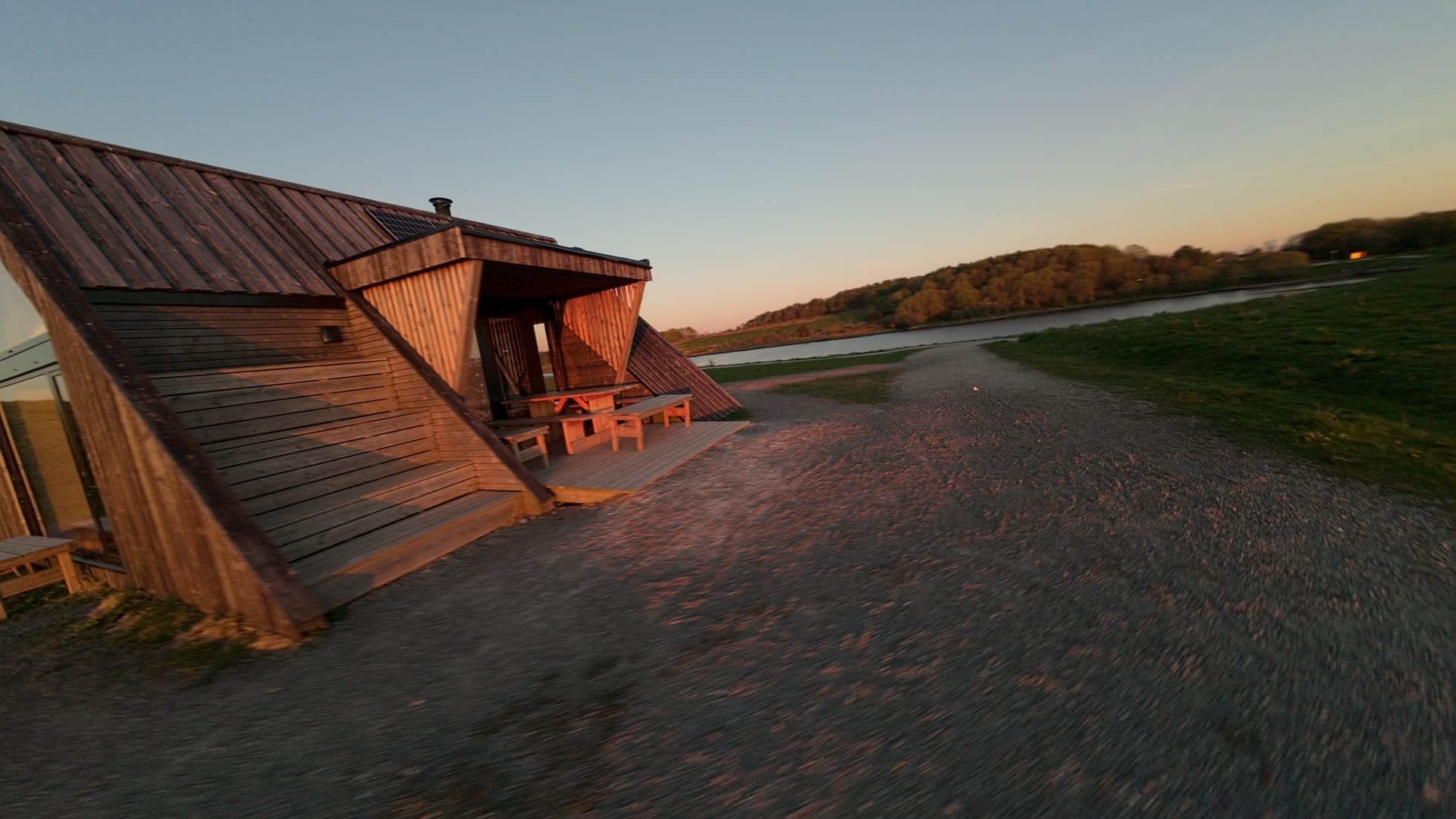 Tilted sinking cabin on coastal shore, Stavanger, Hundvåg dagturshytta