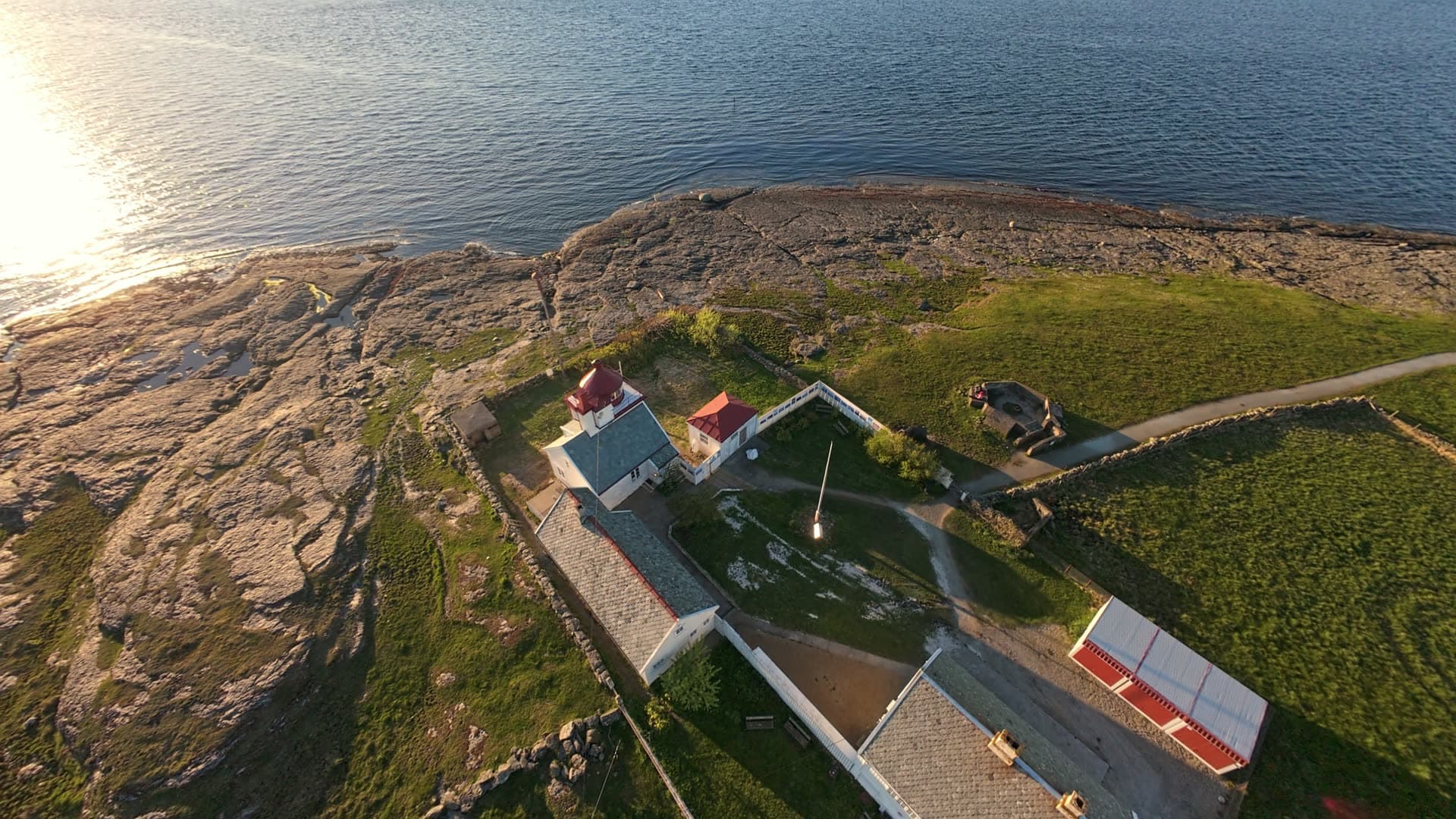Coastal village houses on rocky shore, Tungenes fyr