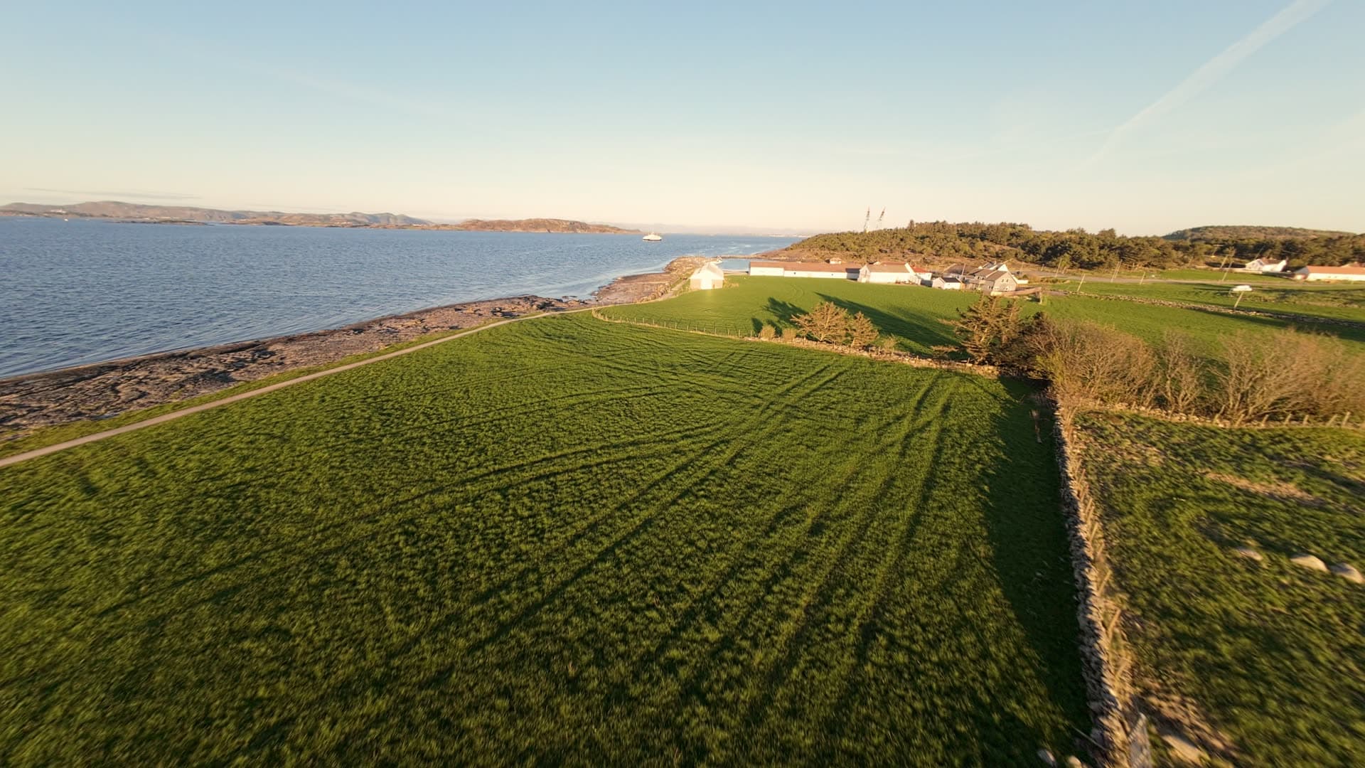 Coastal farm with rocky harbor, Tungenes fyr