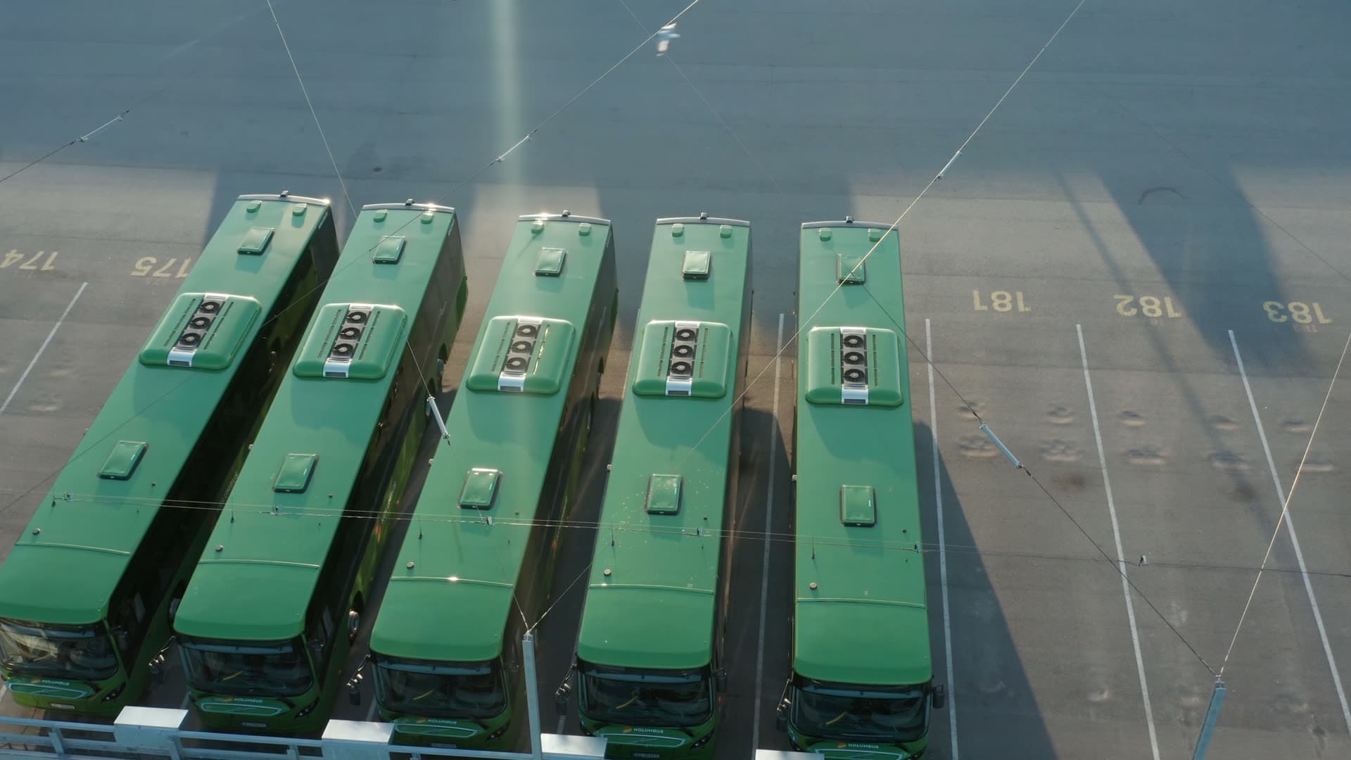 Kolumbus Green buses parked at transit depot, Forus