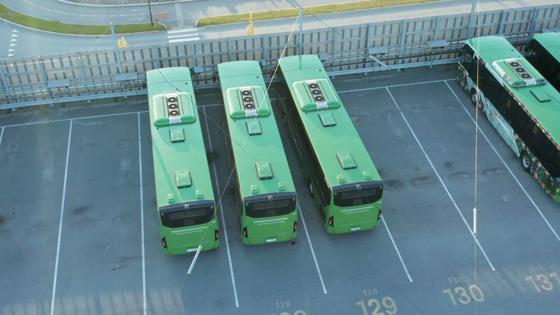 Kolumbus Green buses parked at transit depot, Forus