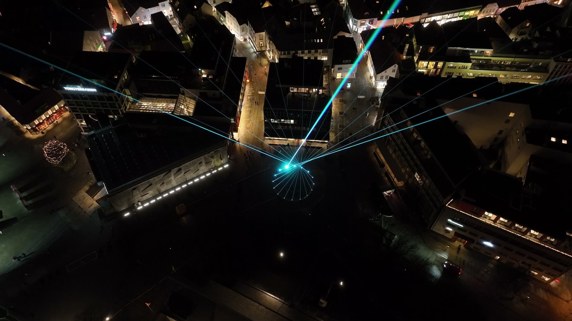 Night city lights with blue light beam, Stavanger, Glød