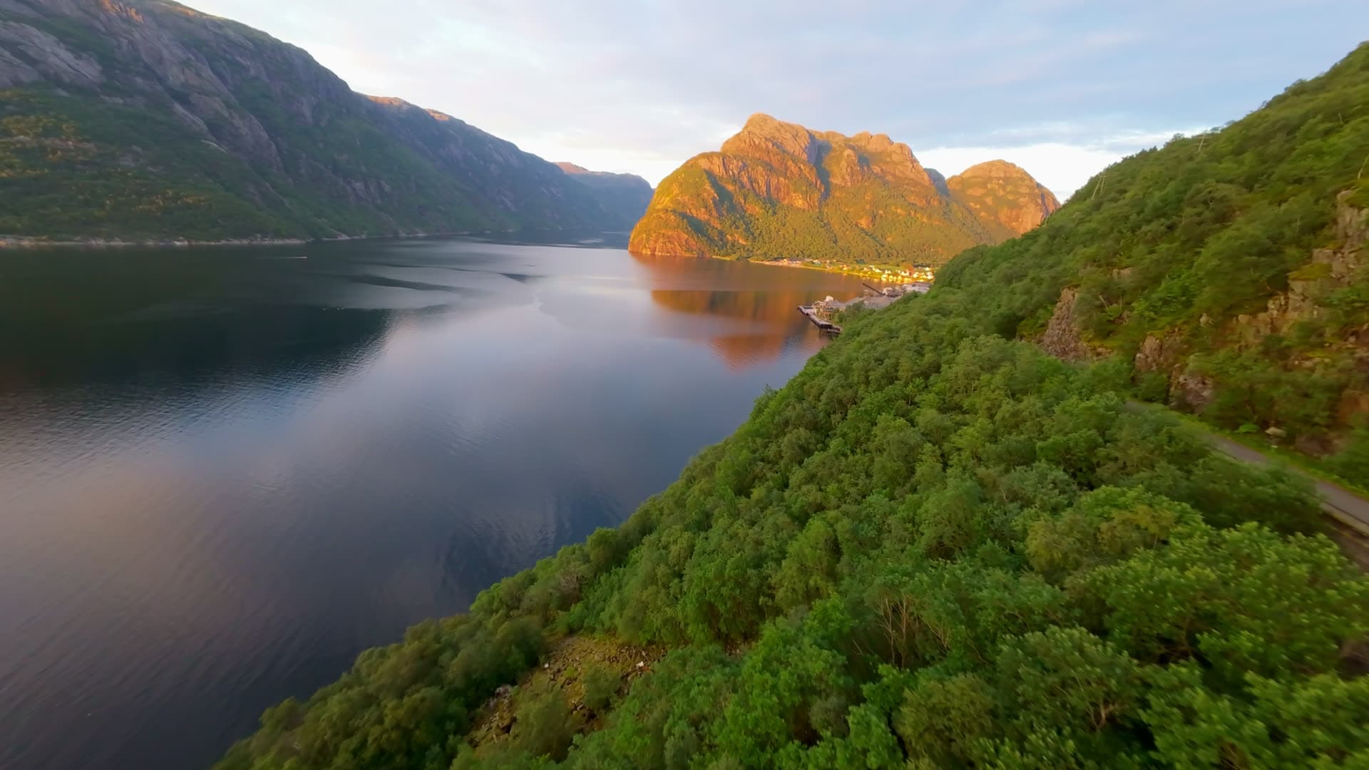 Mountain peaks above calm fjord water, Dirdal