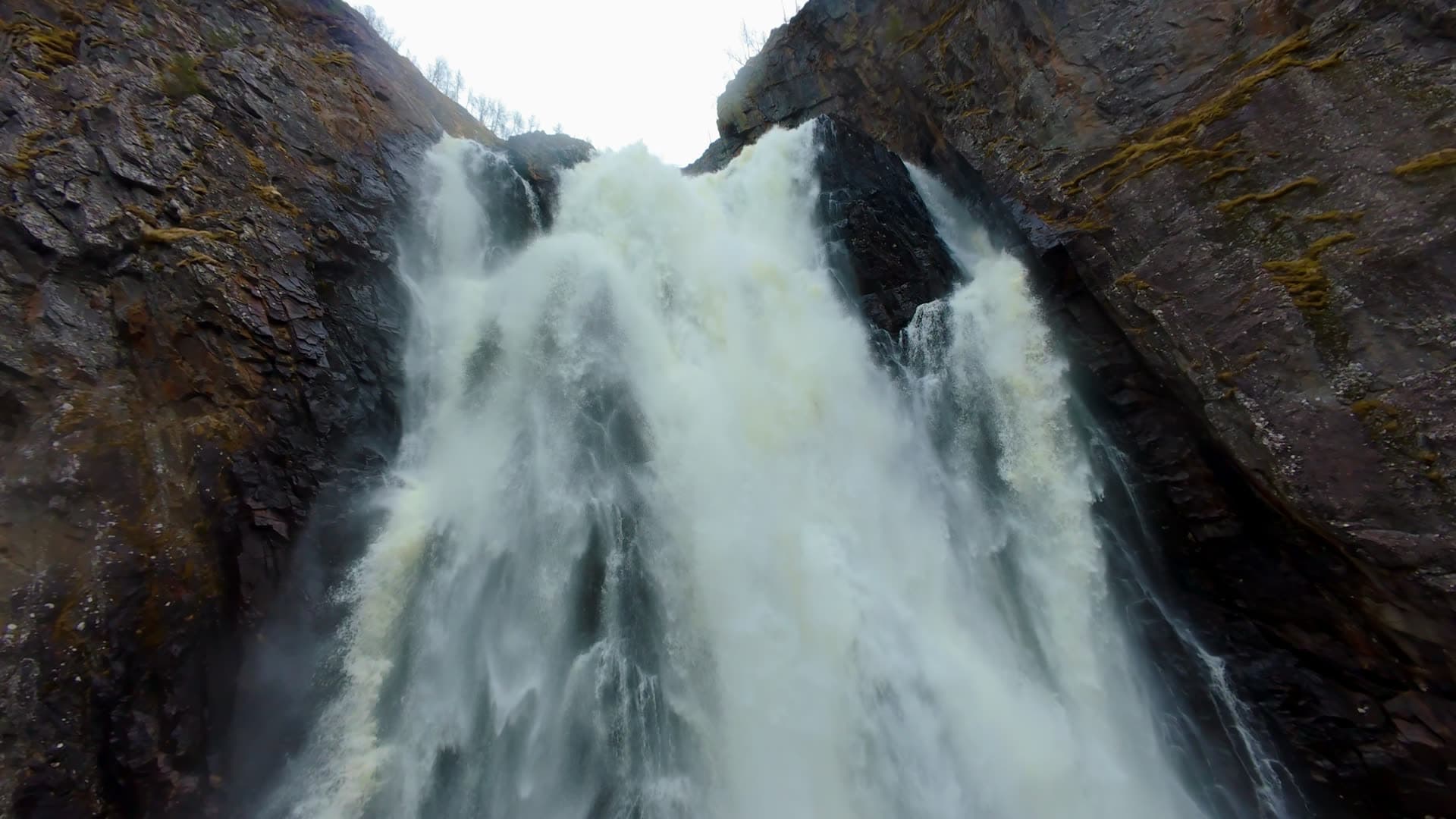 Waterfall flowing through rocky gorge, Vøringsfossen
