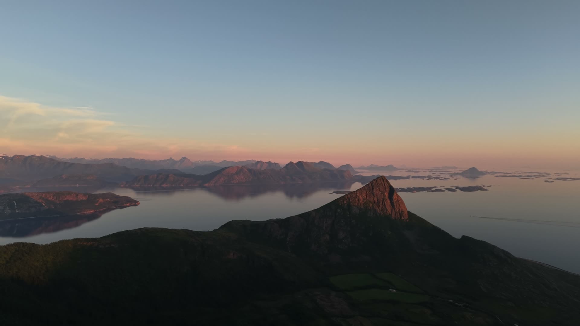 Mountain peak above misty fjord at sunrise, Reipå