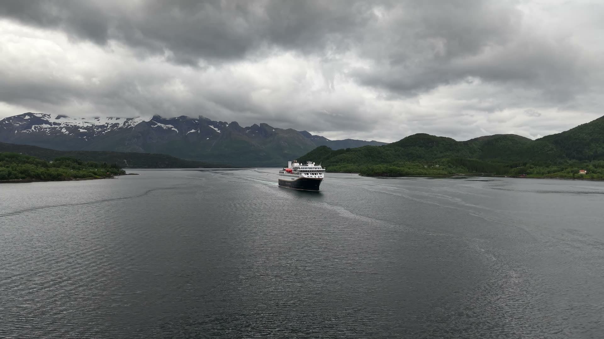 Cruise ship in glacier fjord passage, Ørnes