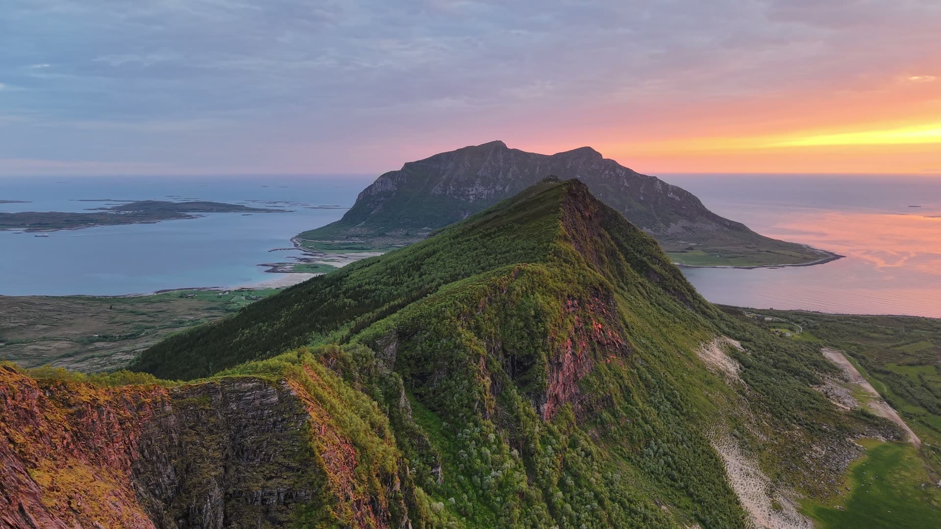Volcanic cone mountains above coastal fjord, Meløy