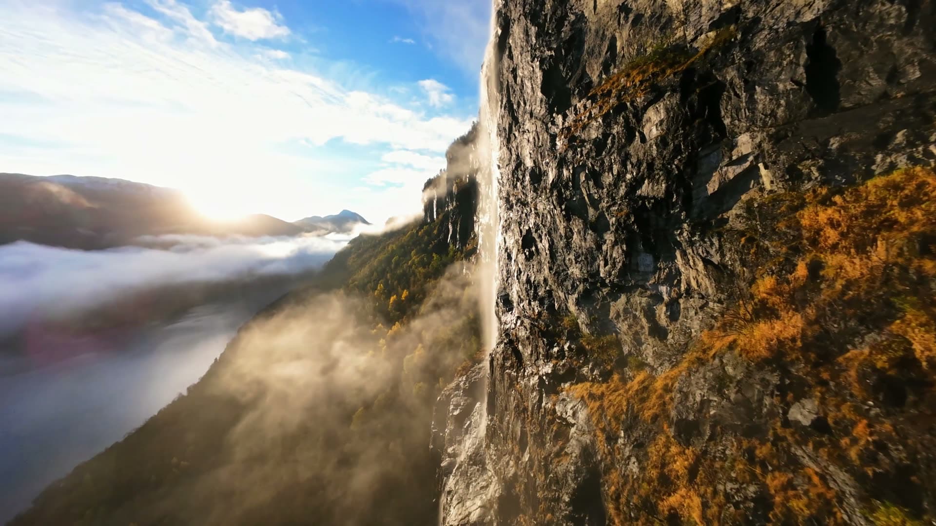 Waterfall plunging from misty cliff, Gloppen