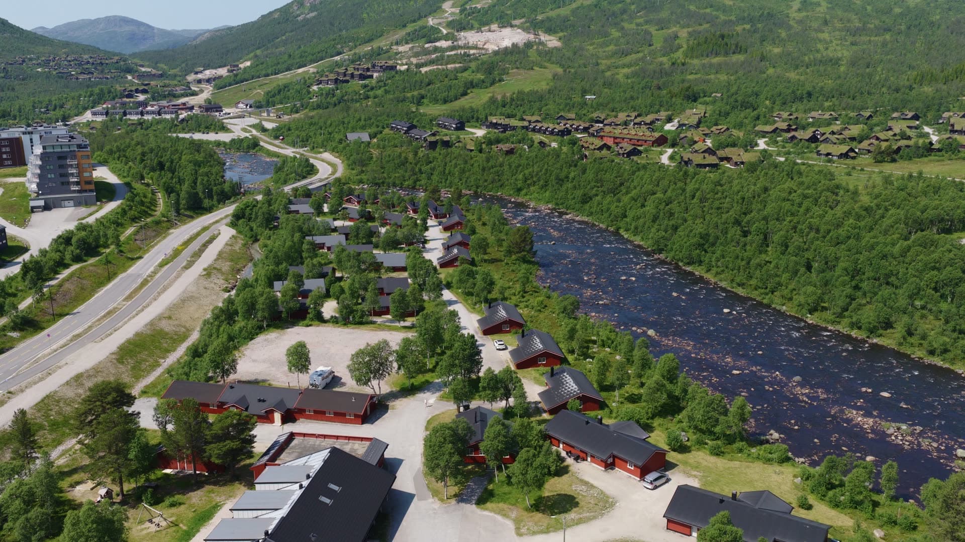 Mountain resort development in forested river valley, Hovden