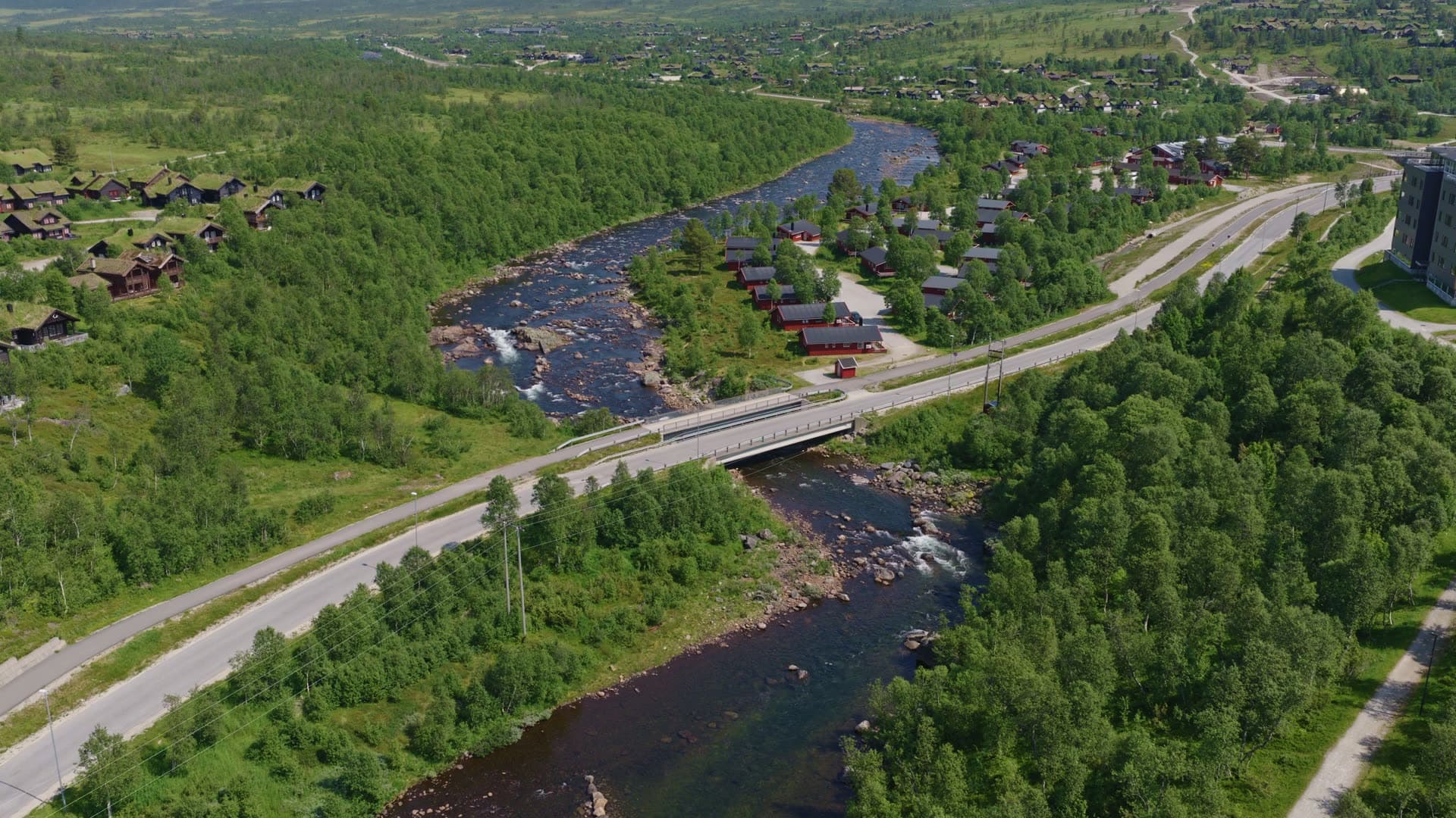 River with waterfall and residential area, Hovden