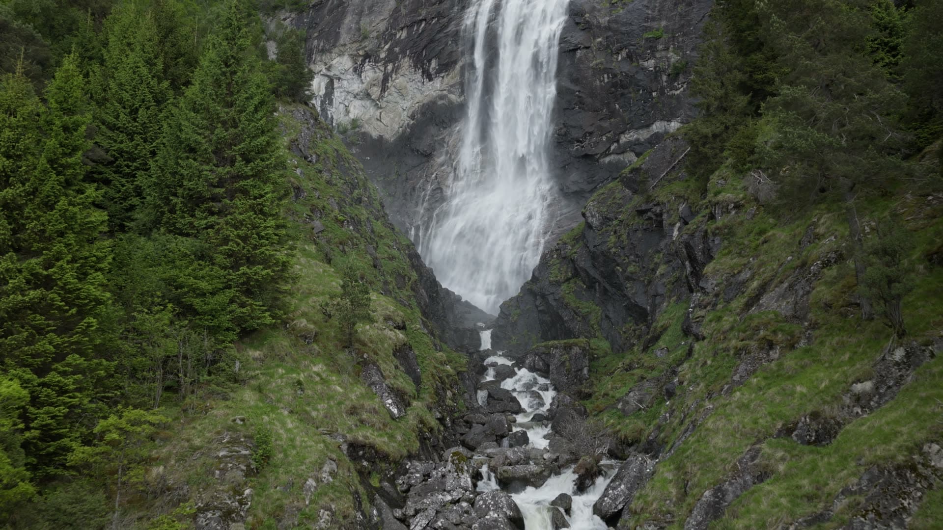 Mountain waterfall in rocky gorge, Kvinnafossen