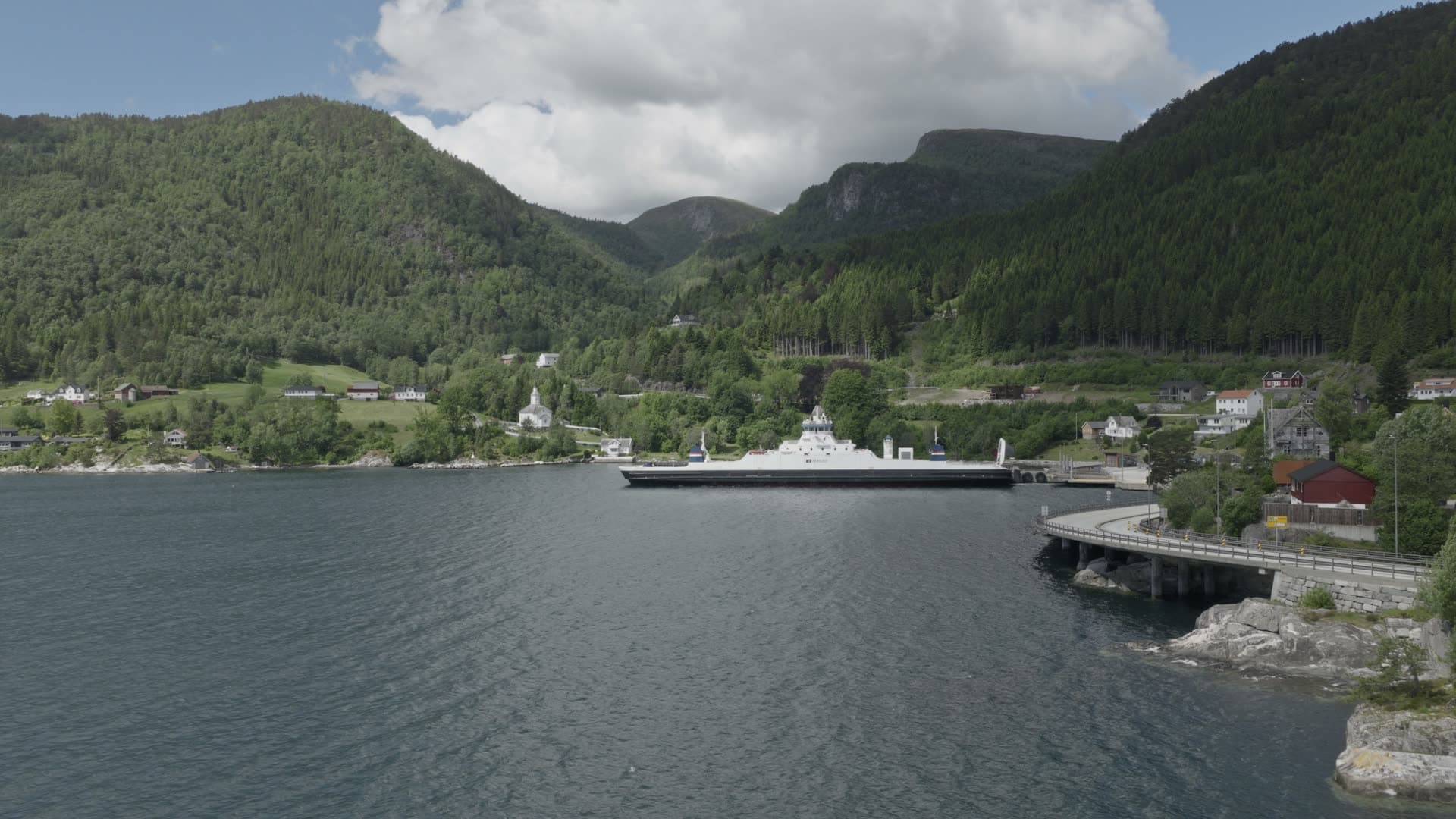 Passenger ferry docked in mountain fjord, Lavik