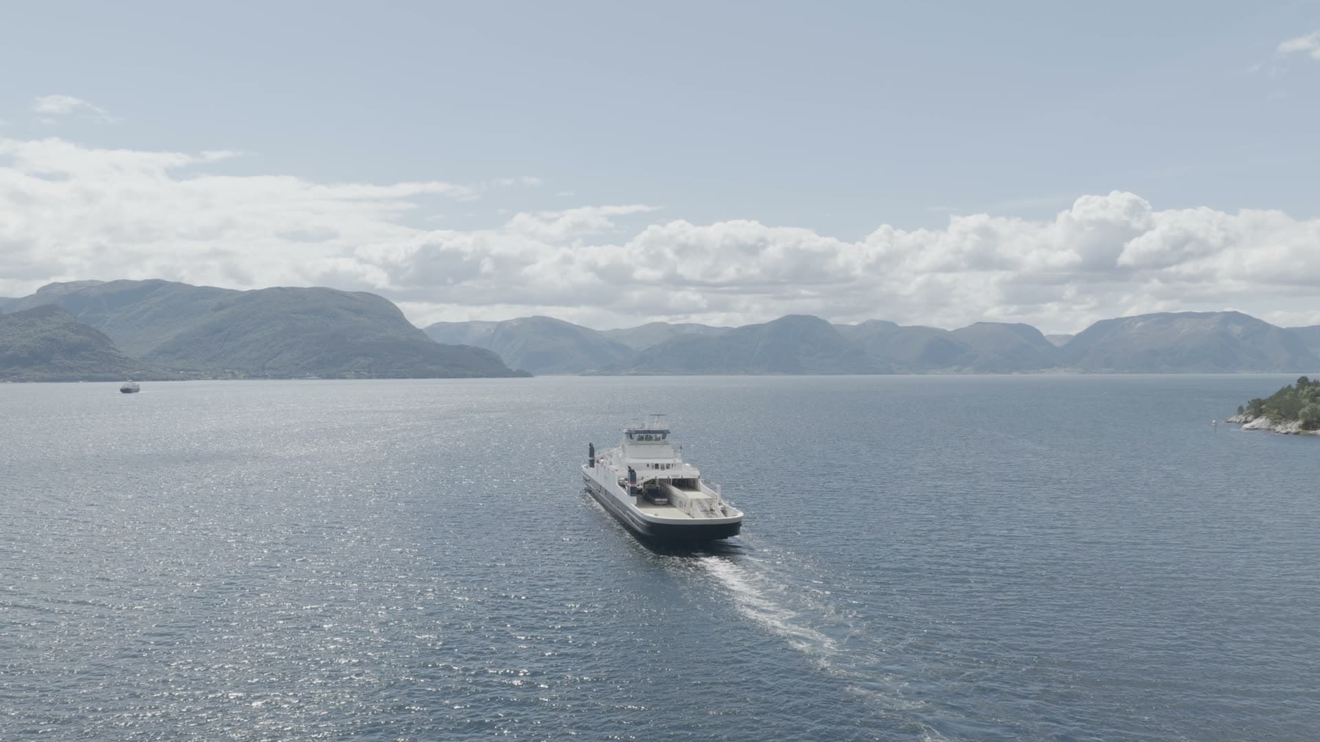 Passenger ferry crossing mountain fjord, Lavik