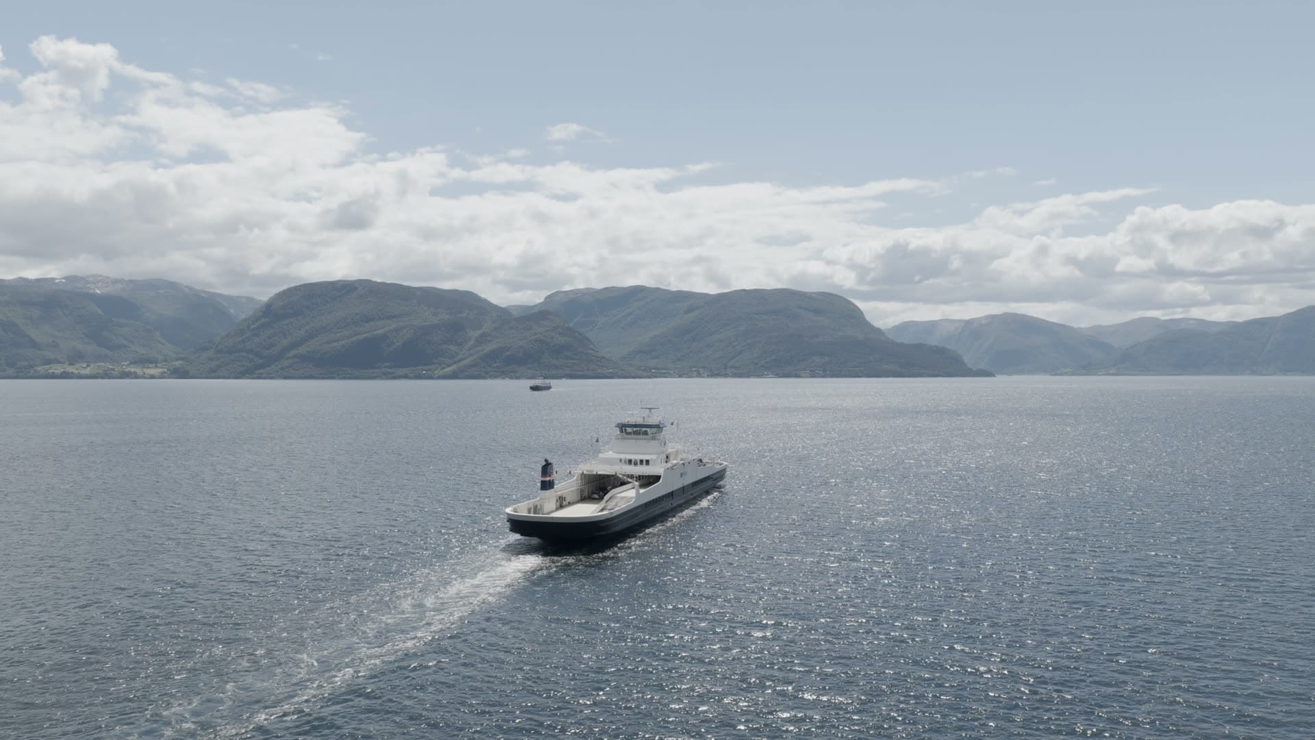 Passenger ferry in mountainous fjord, Lavik