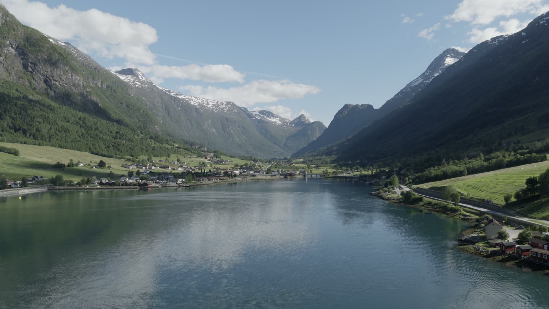 Alpine valley lake and mountain settlement, Olden
